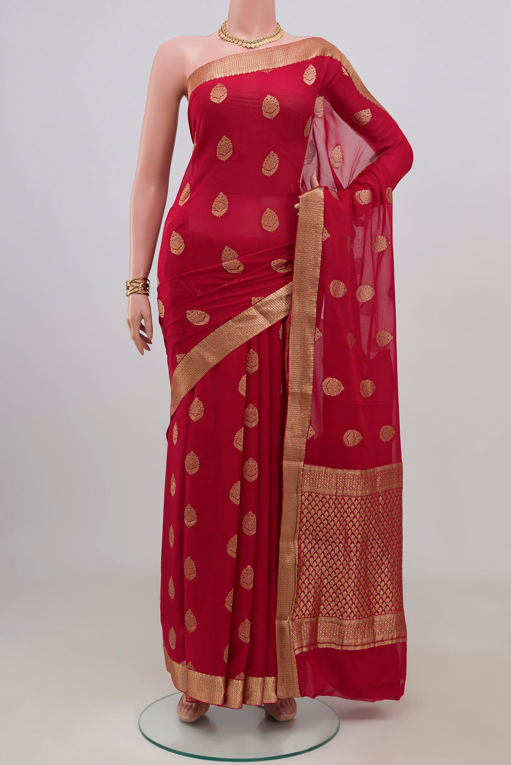Red Mysore Georgette Saree with Zari Butta on the body and Zari Border.  displayed on a mannequin