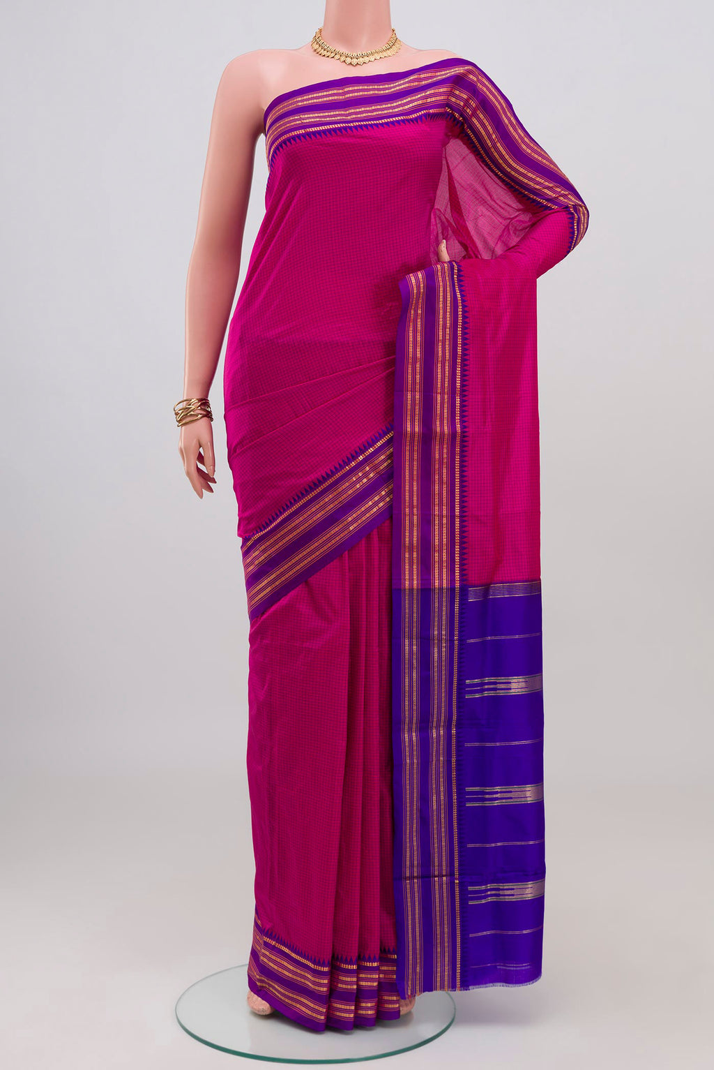 Pink Narayanpet Silk Saree with Checked design on the body and Zari Border.  displayed on a mannequin