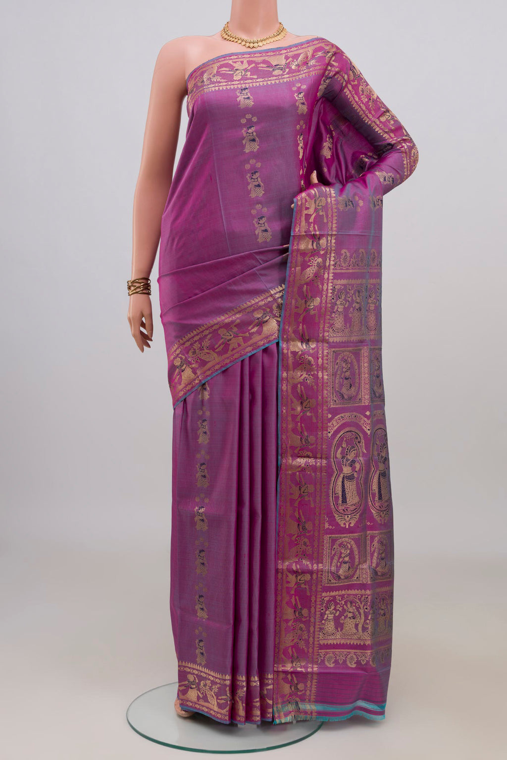 Pure Silk Purple Baluchari Saree with Zari Butta on the body and Zari Border.  displayed on a mannequin