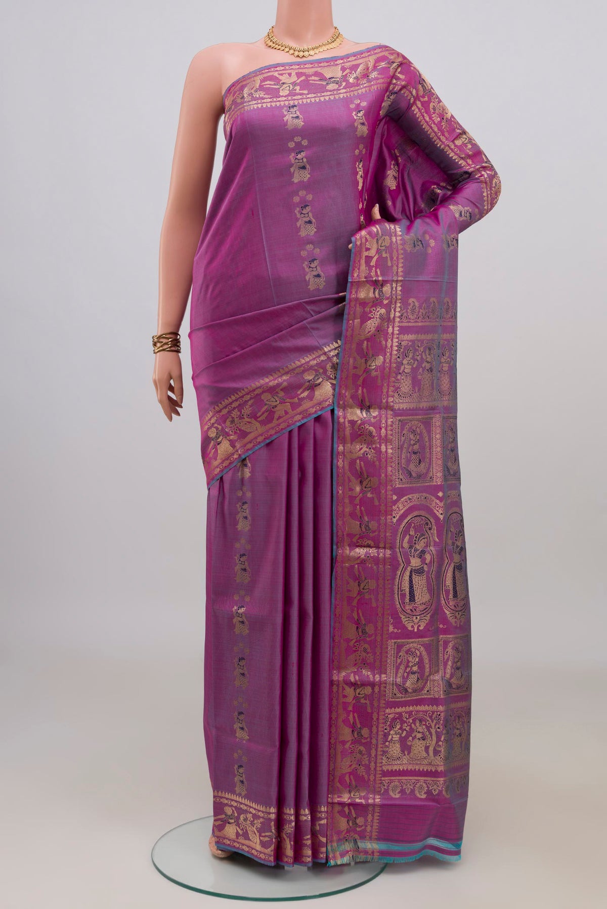 Pure Silk Purple Baluchari Saree with Zari Butta on the body and Zari Border.  displayed on a mannequin