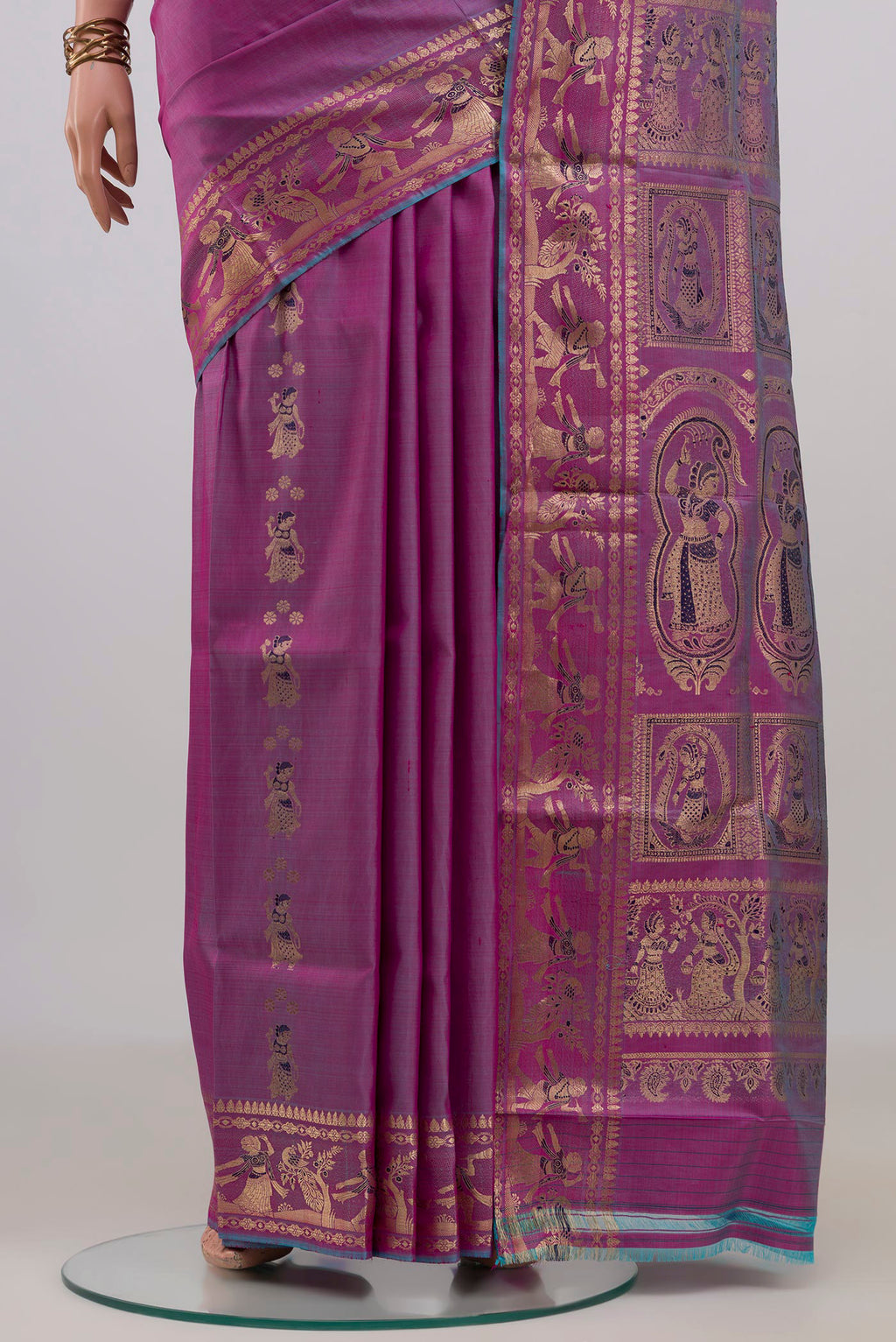 Pleats and pallu of Pure Silk Purple Baluchari Saree with Zari Butta on the body and Zari Border. 