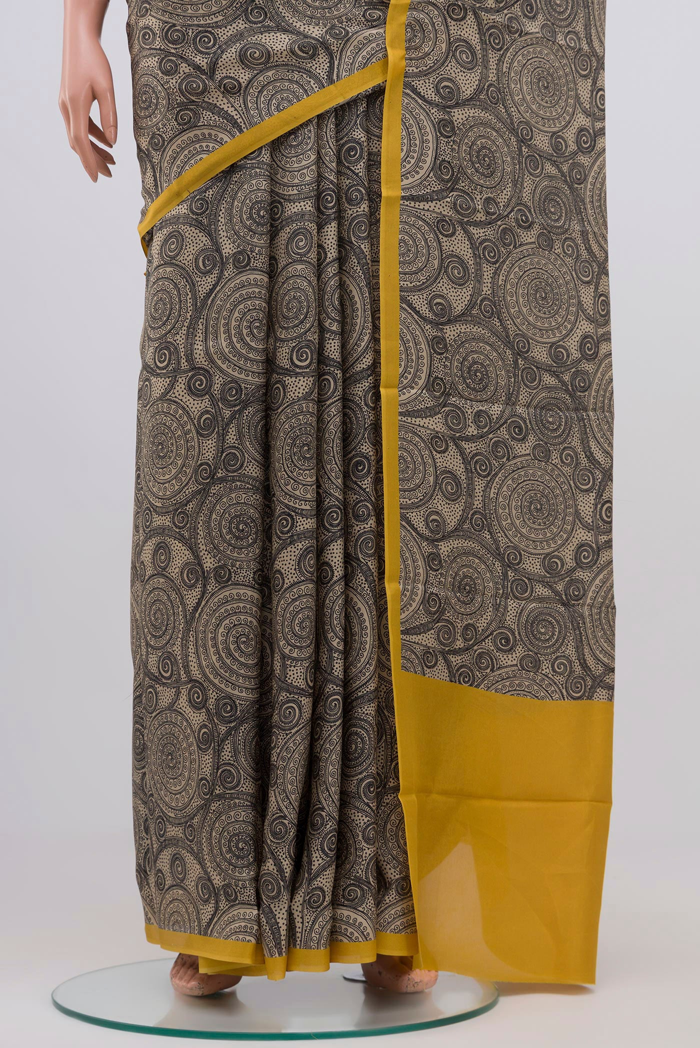 Pleats and pallu of Beige Printed Silk Saree with Printed design on the body and Plain Border. 