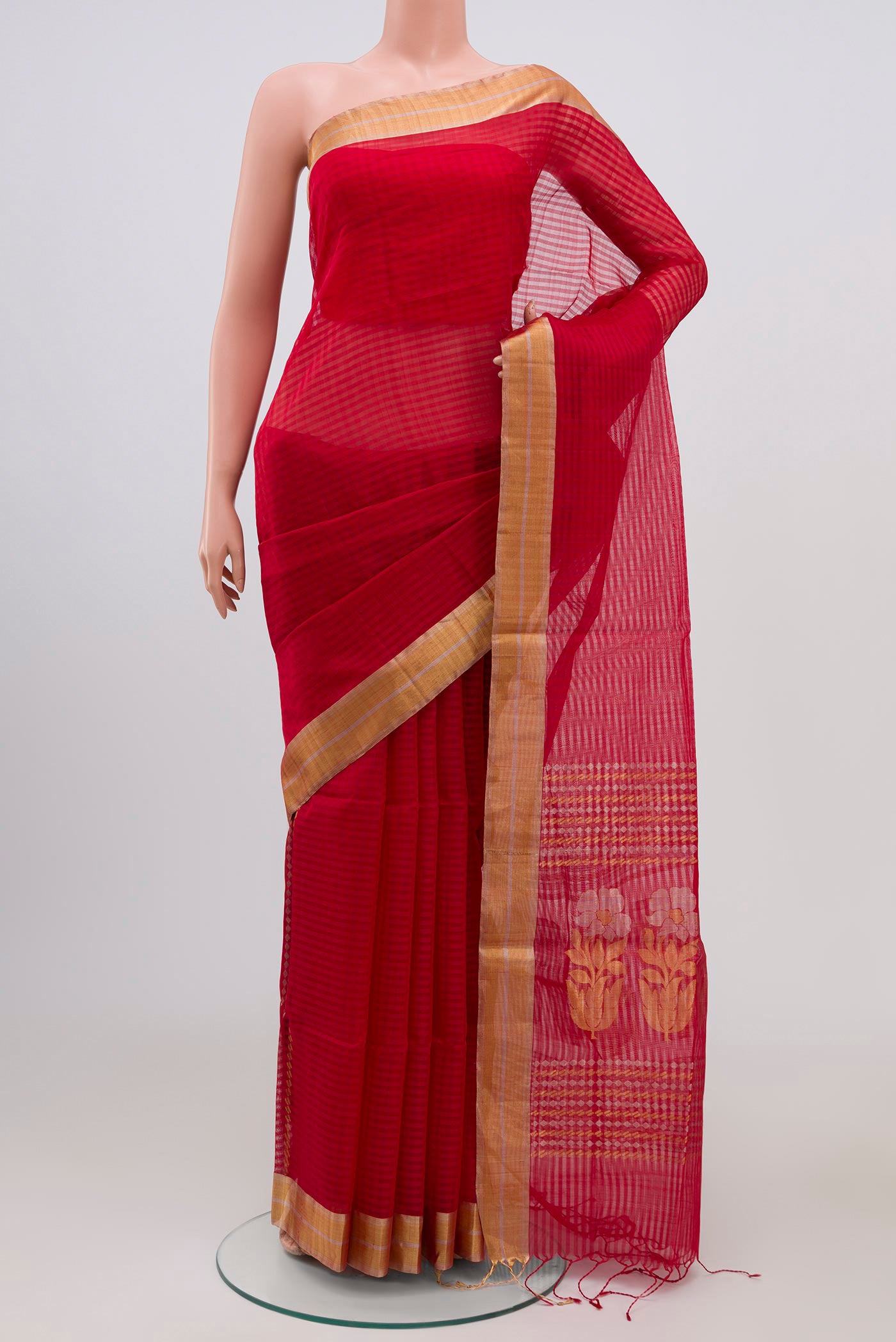 Red Silk Cotton Saree with Checked design on the body and Zari Border.  displayed on a mannequin