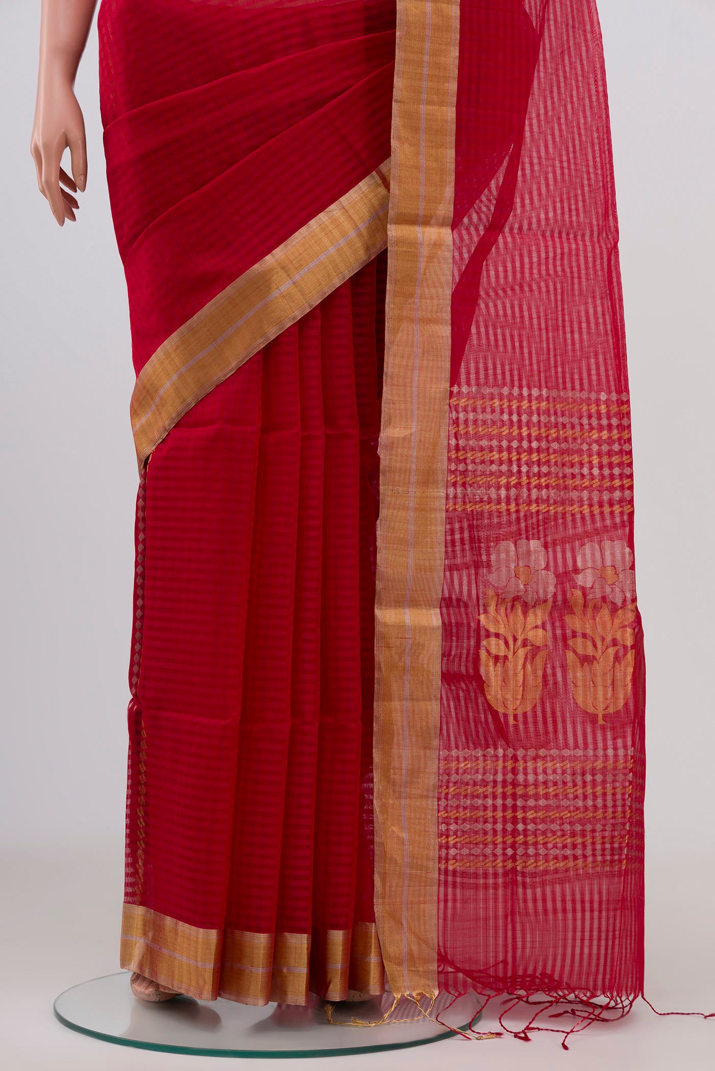 Pleats and pallu of Red Silk Cotton Saree with Checked design on the body and Zari Border. 