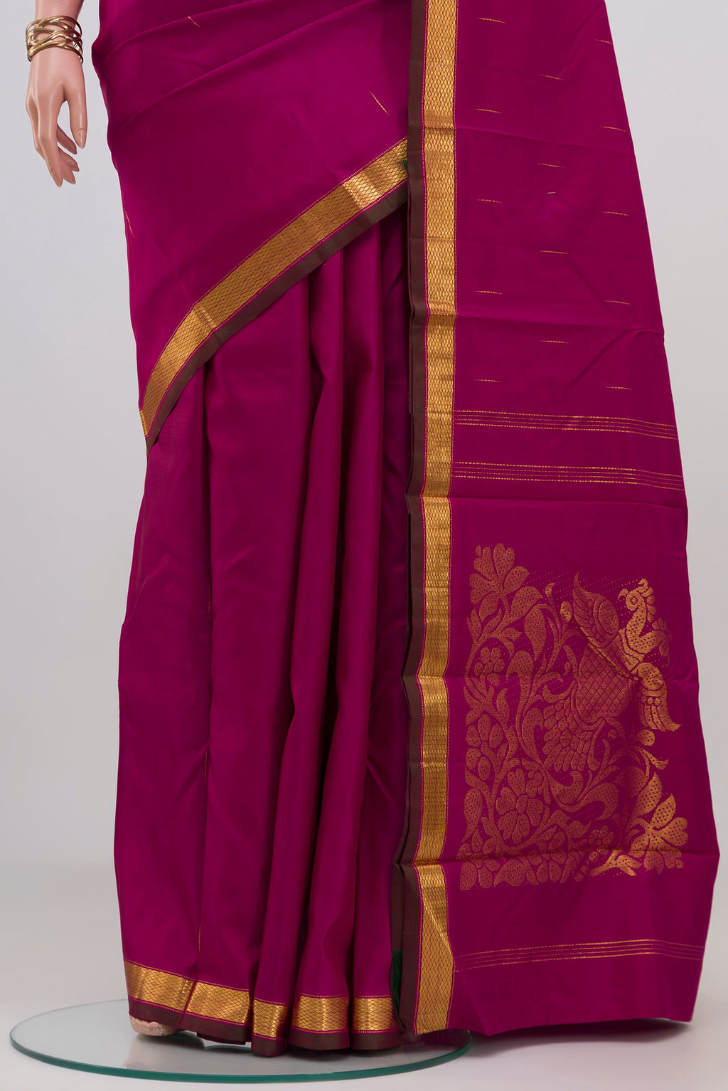 Pleats and pallu of Magenta Kanjivaram Silk Saree with Zari Butta on the body and Zari Border. 
