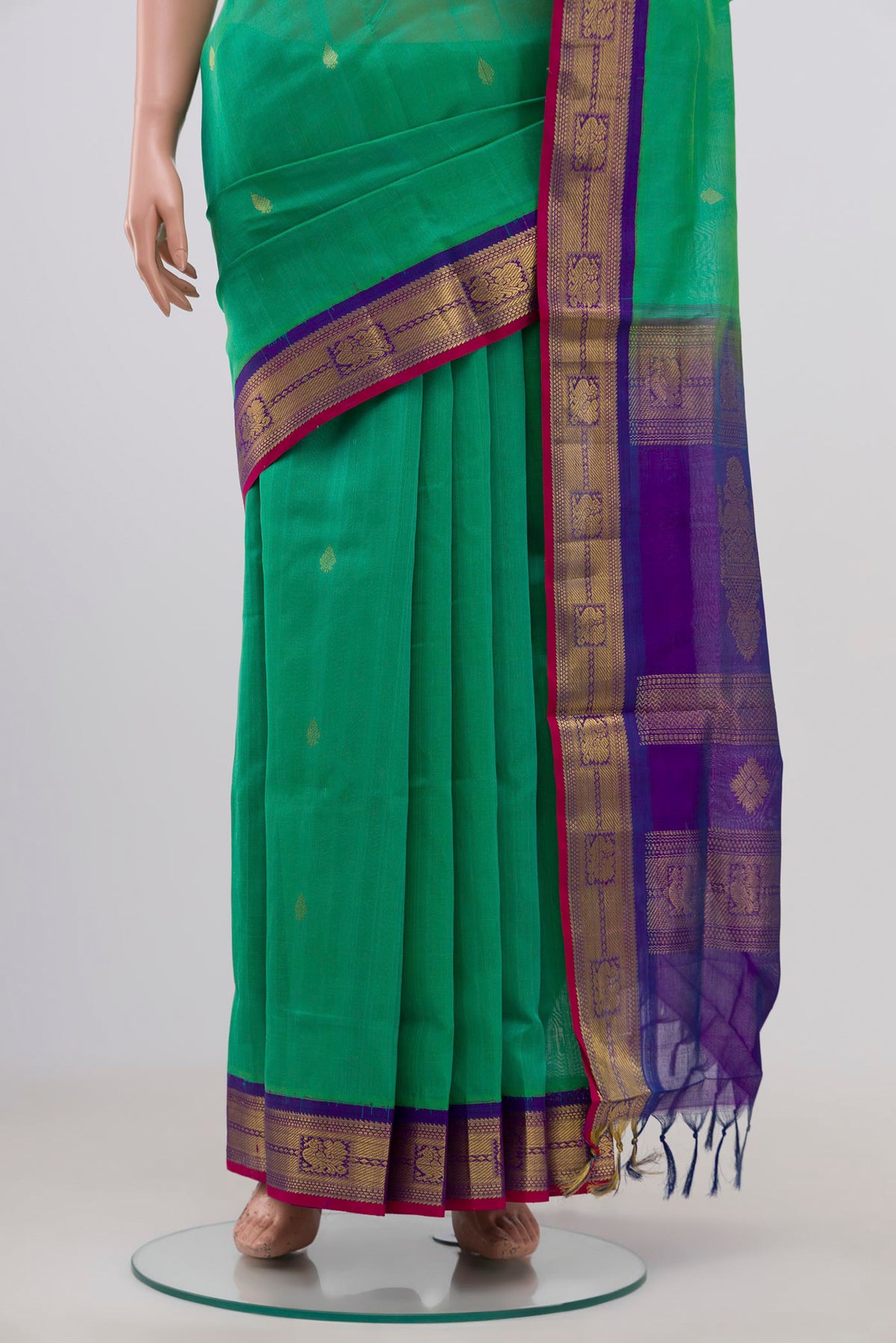Pleats and pallu of Green Coimbatore Silk Cotton Saree with Zari Butta on the body and Zari Border. 