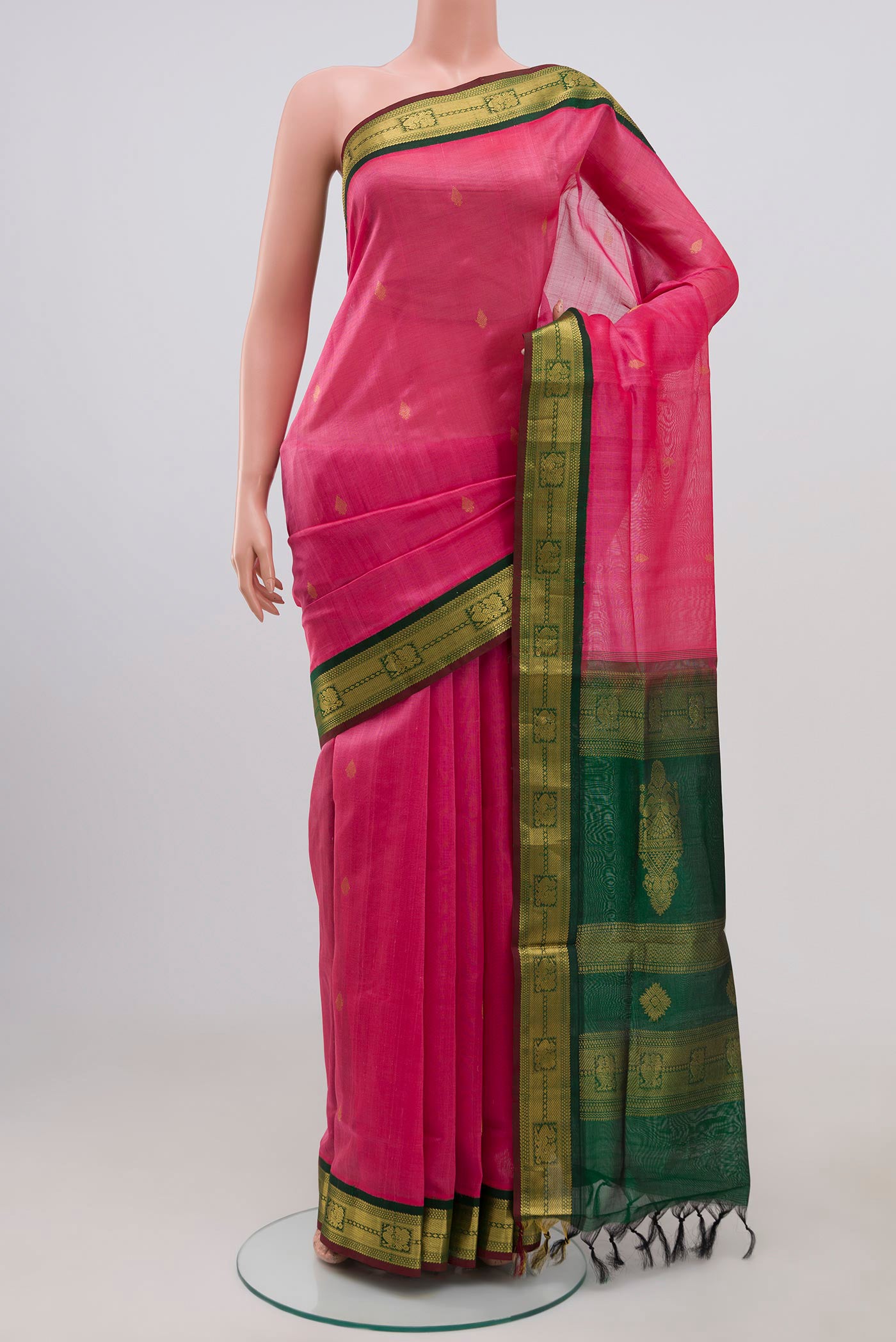 Pink Coimbatore Silk Cotton Saree with Zari Butta on the body and Zari Border.  displayed on a mannequin