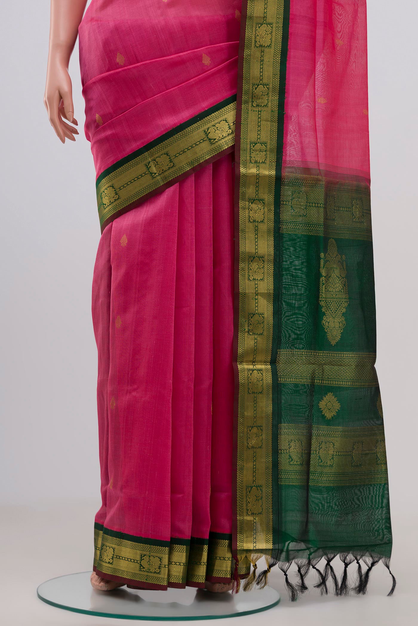 Pleats and pallu of Pink Coimbatore Silk Cotton Saree with Zari Butta on the body and Zari Border. 