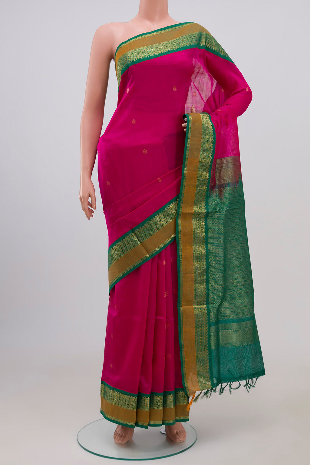 Rani Pink Coimbatore Silk Cotton Saree with Zari Butta on the body and Zari Border.  displayed on a mannequin