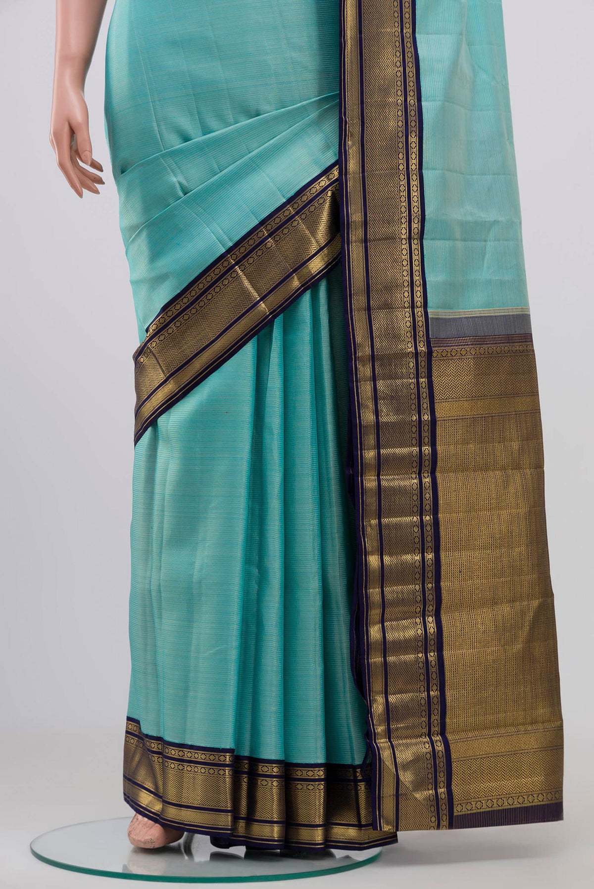 Pleats and pallu of Pure Silk Pure Zari Sky Blue Kanchipuram Saree with Stripes on the body and Zari Border. 