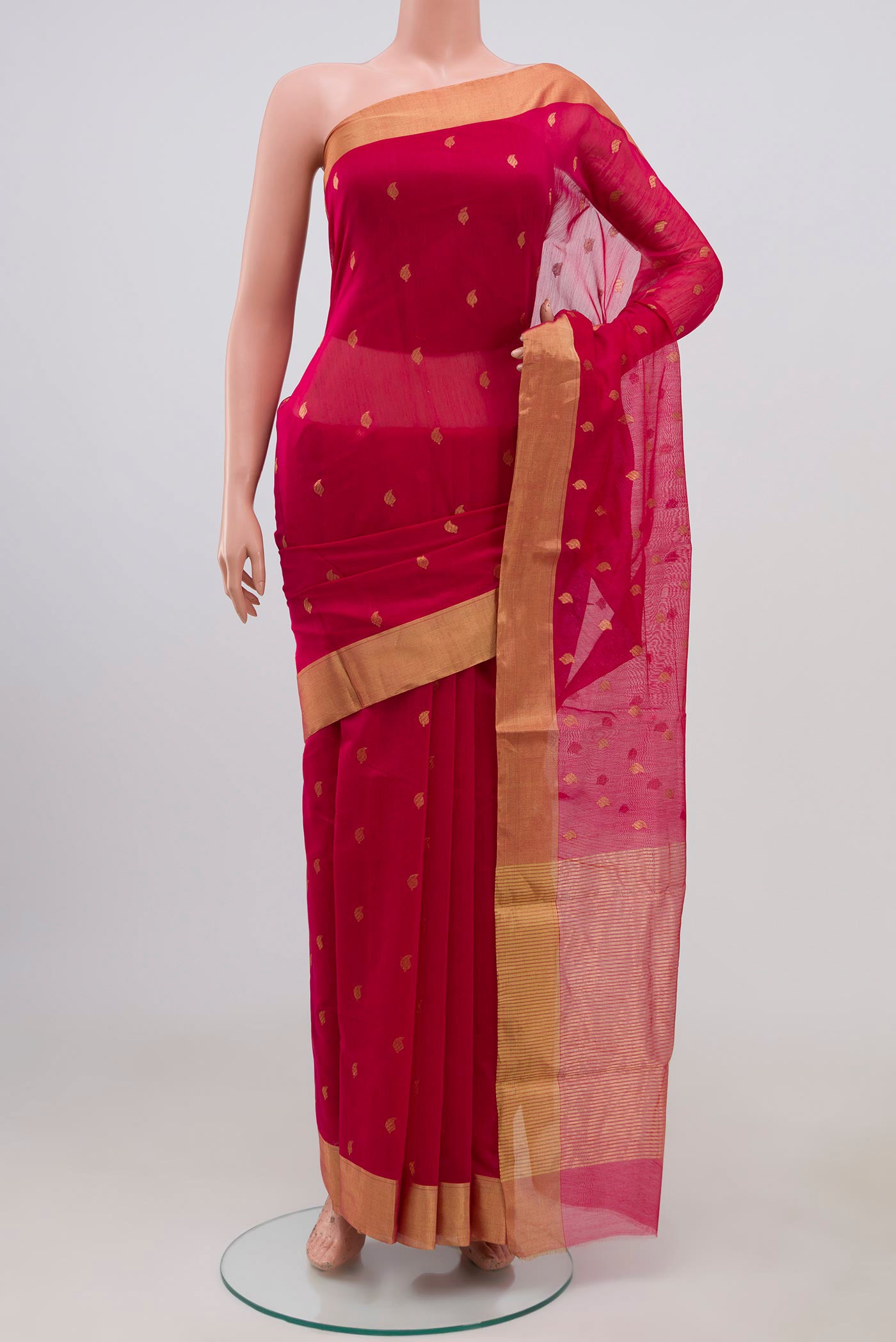 Pink Chanderi Silk Cotton Saree with Zari Butta on the body and Zari Border.  displayed on a mannequin