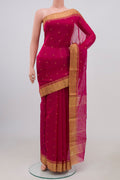 Pink Chanderi Silk Cotton Saree with Zari Butta on the body and Zari Border.  displayed on a mannequin