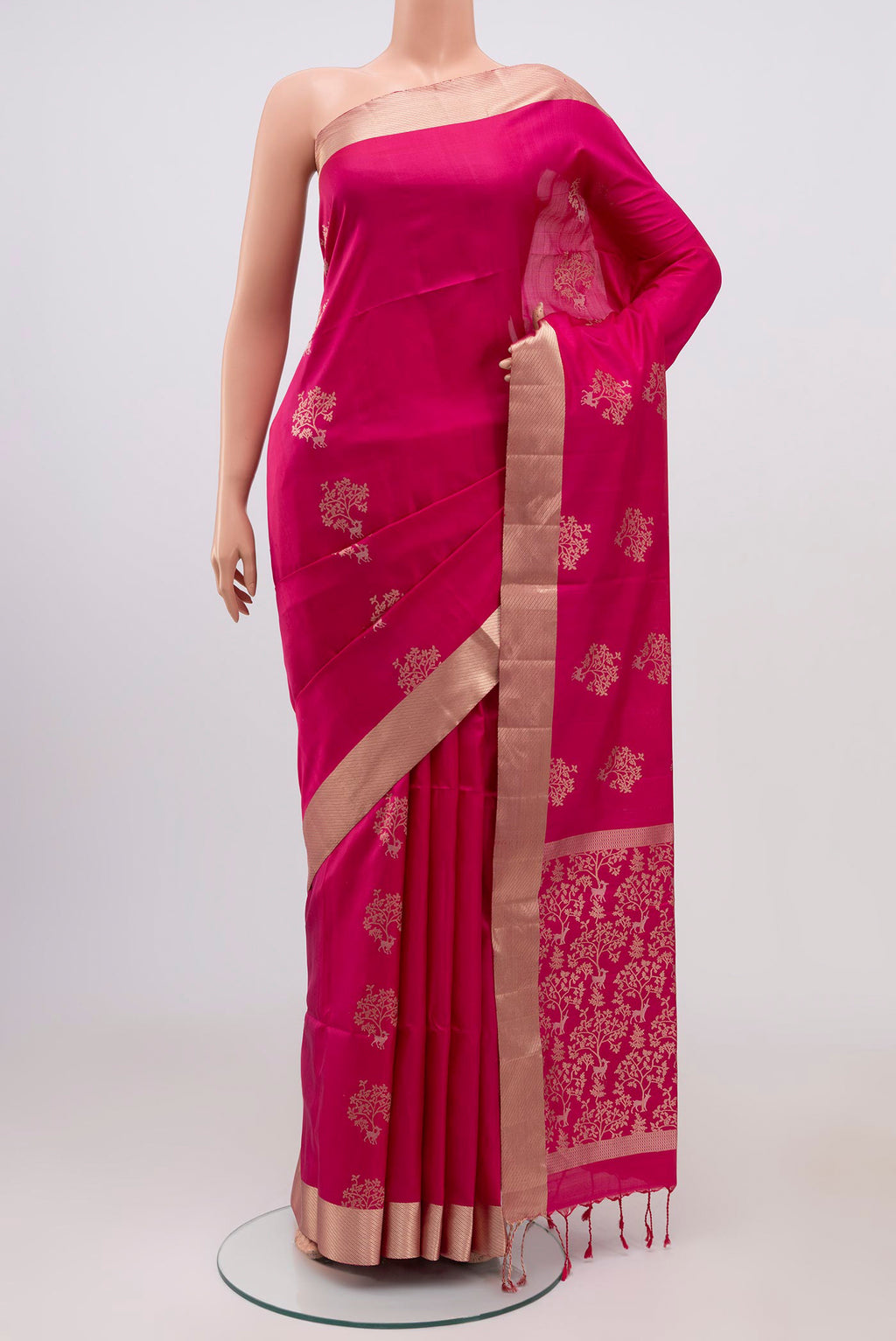 Pink Soft Silk Saree with Zari Butta on the body and Zari Border.  displayed on a mannequin