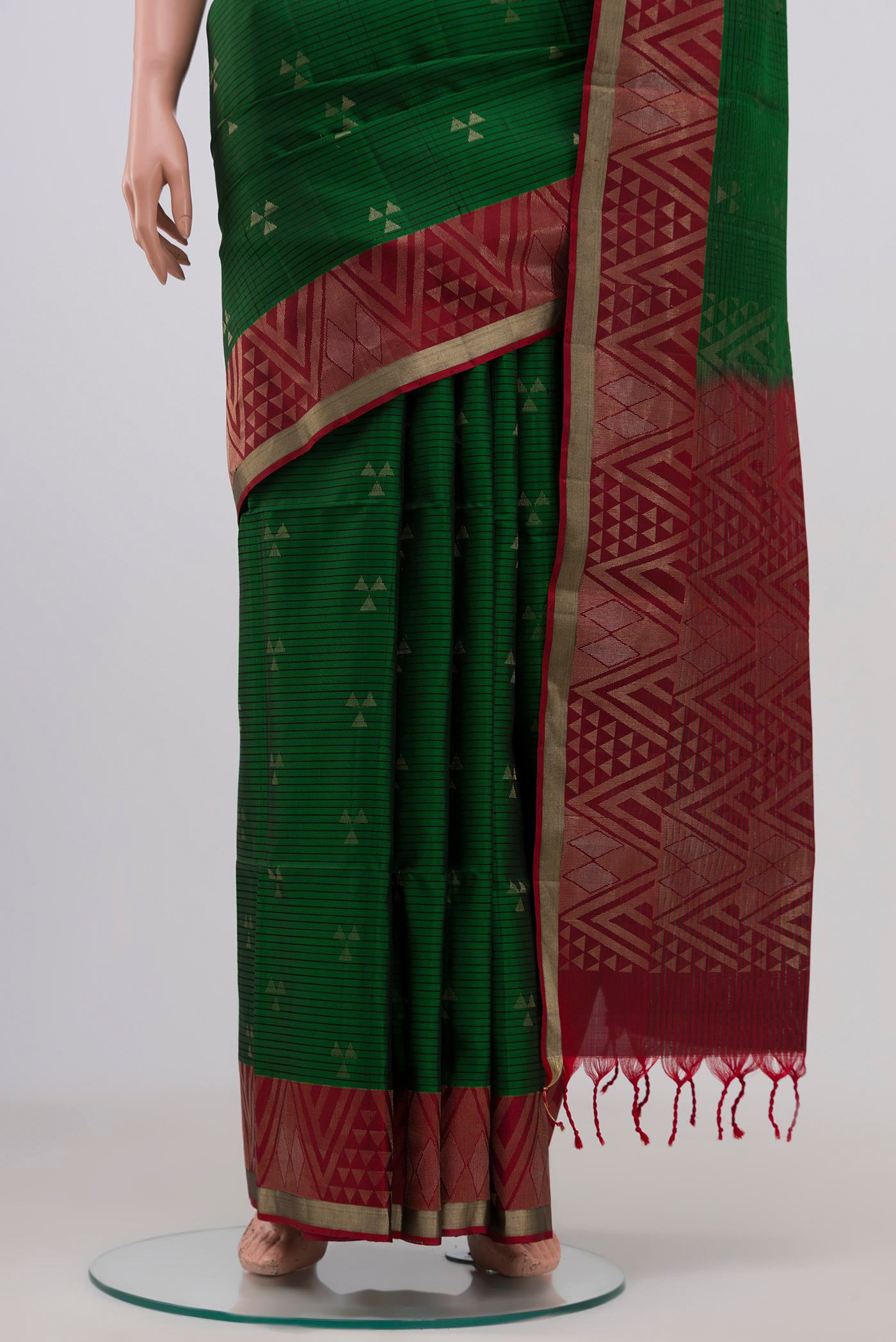 Pleats and pallu of Green Soft Silk Saree with Zari Butta on the body and Fancy Border. 