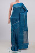 Pure Silk Pure Zari Blue Kanchipuram Saree with Checked design on the body and Thin Zari Line.  displayed on a mannequin