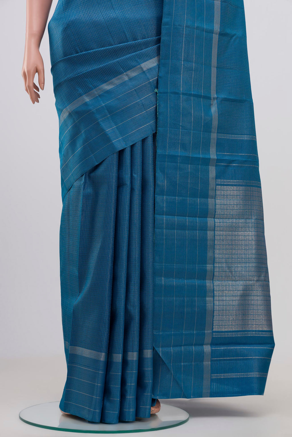 Pleats and pallu of Pure Silk Pure Zari Blue Kanchipuram Saree with Checked design on the body and Thin Zari Line. 
