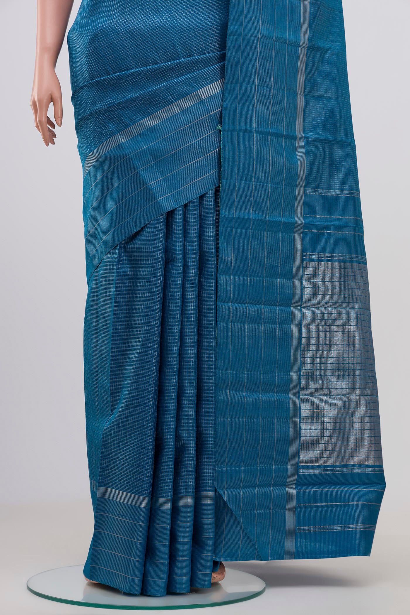Pleats and pallu of Pure Silk Pure Zari Blue Kanchipuram Saree with Checked design on the body and Thin Zari Line. 