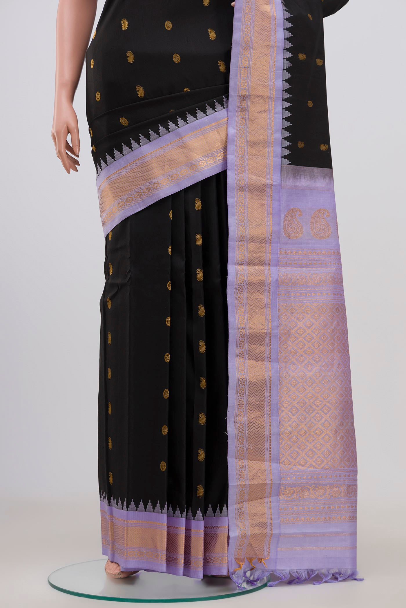 Pleats and pallu of Black Gadwal Silk Saree with Zari Butta on the body and Zari Border. 