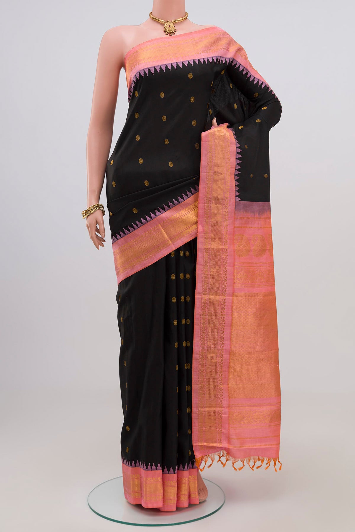 Black Gadwal Silk Saree with Zari Butta on the body and Zari Border.  displayed on a mannequin