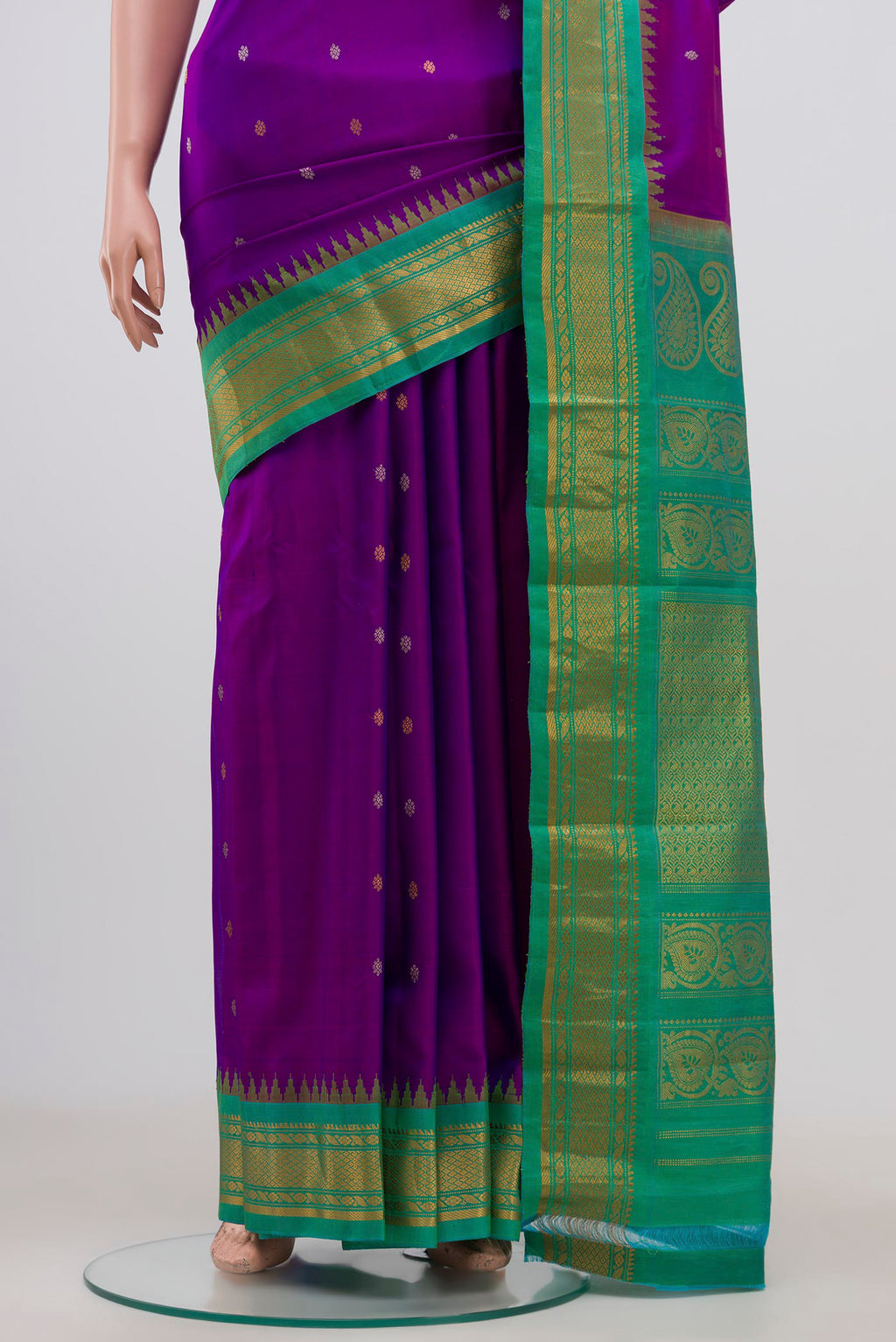 Pleats and pallu of Purple Gadwal Silk Saree with Zari Butta on the body and Zari Border. 