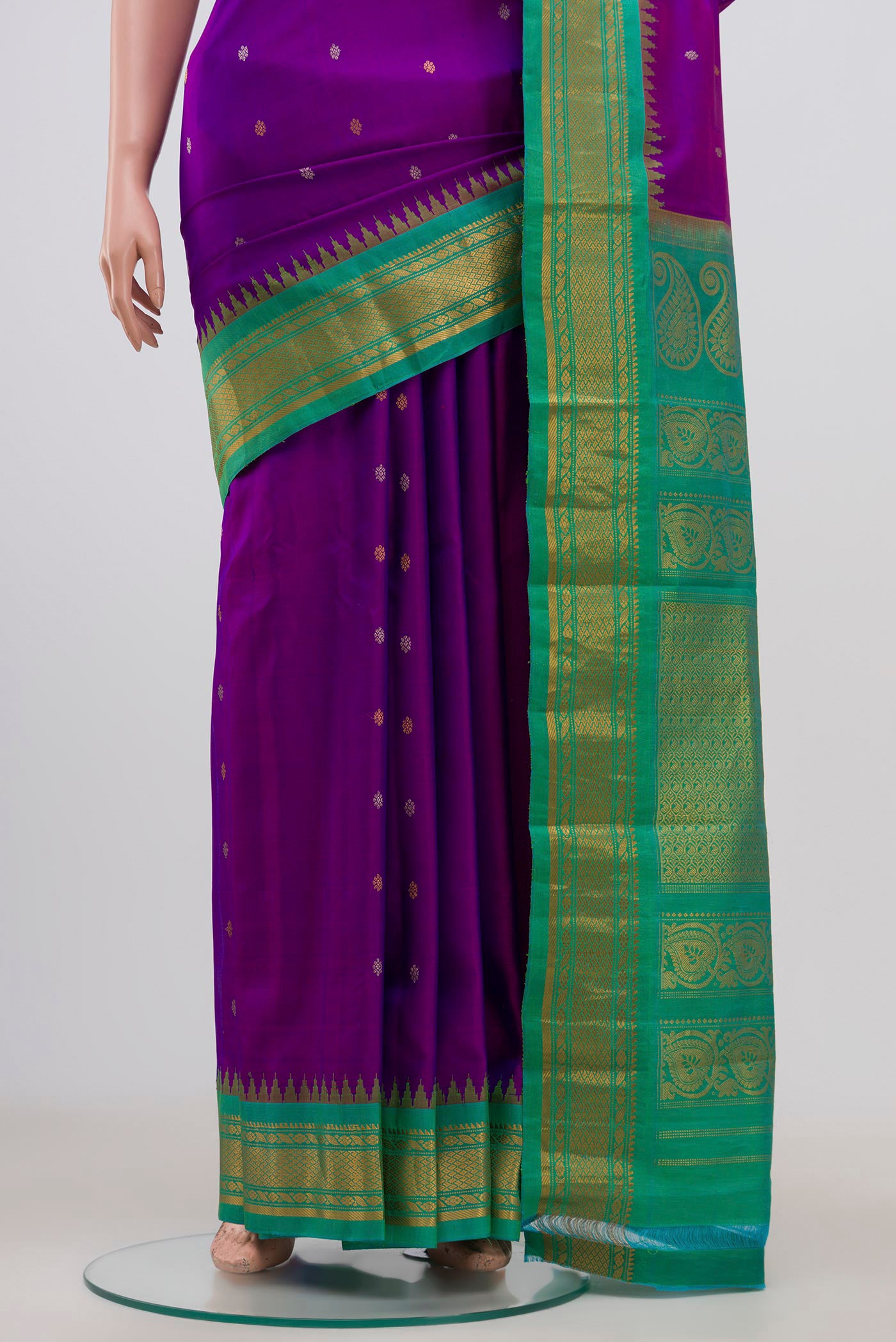 Pleats and pallu of Purple Gadwal Silk Saree with Zari Butta on the body and Zari Border. 