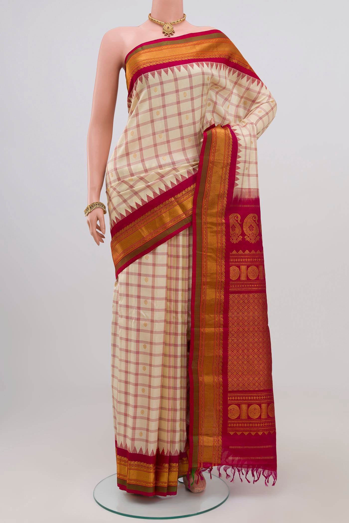 Cream Gadwal Silk Saree with Checked design on the body and Zari Border.  displayed on a mannequin