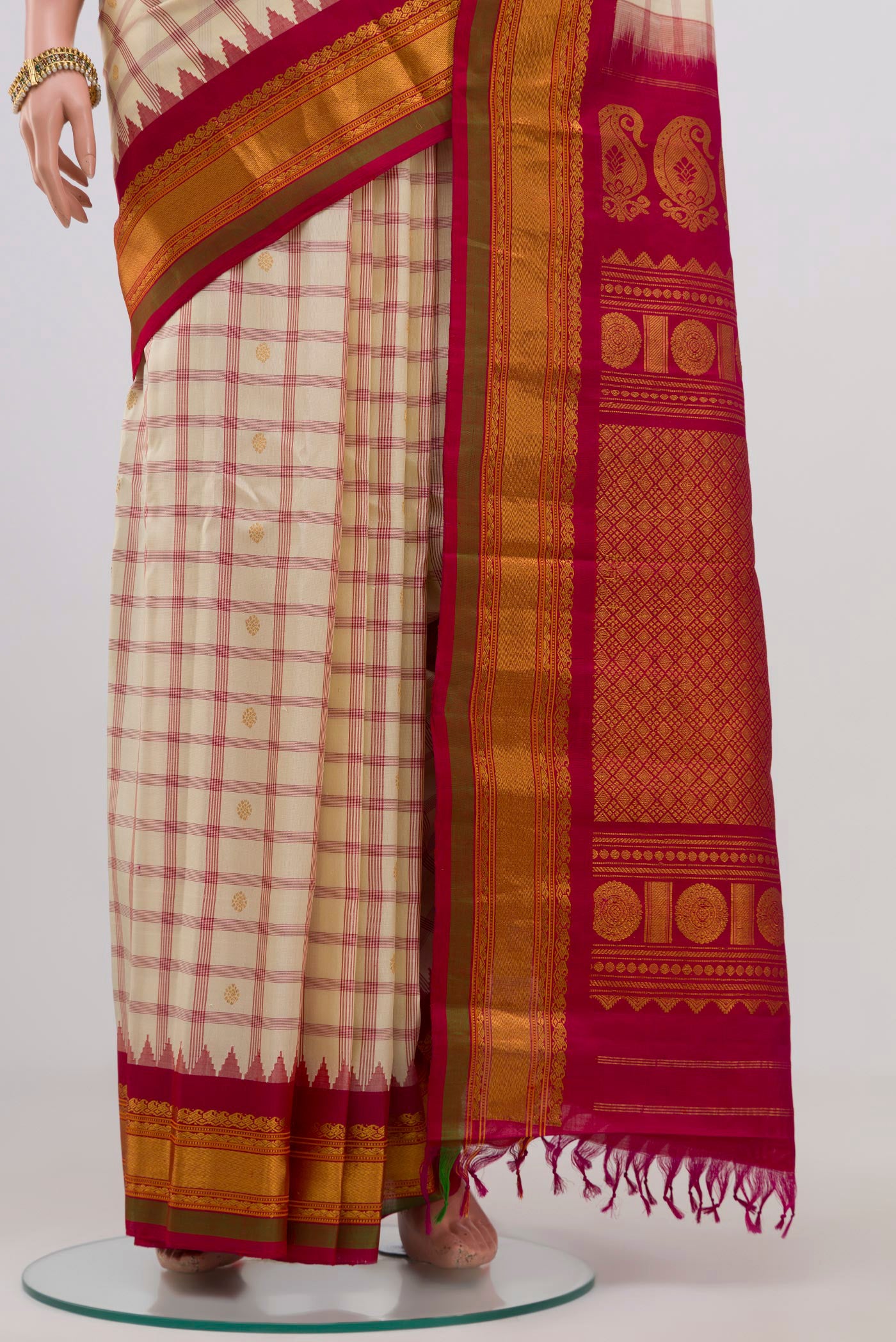 Pleats and pallu of Cream Gadwal Silk Saree with Checked design on the body and Zari Border. 