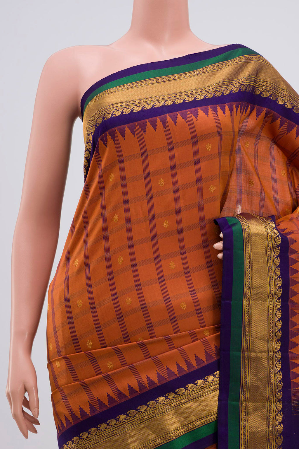 Border image of Rust Gadwal Silk Saree with Zari Butta on the body and Zari Border. 