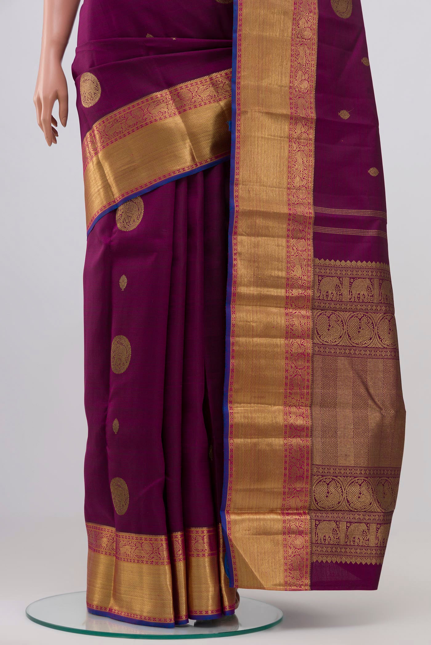 Pleats and pallu of Pure Silk Pure Zari Purple Kanchipuram Saree with Zari Butta on the body and Zari Border. 