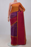 Pure Silk Pure Zari Purple Kanjivaram Saree with Zari Brocade on the body and Ganga Jamuna Border.  displayed on a mannequin