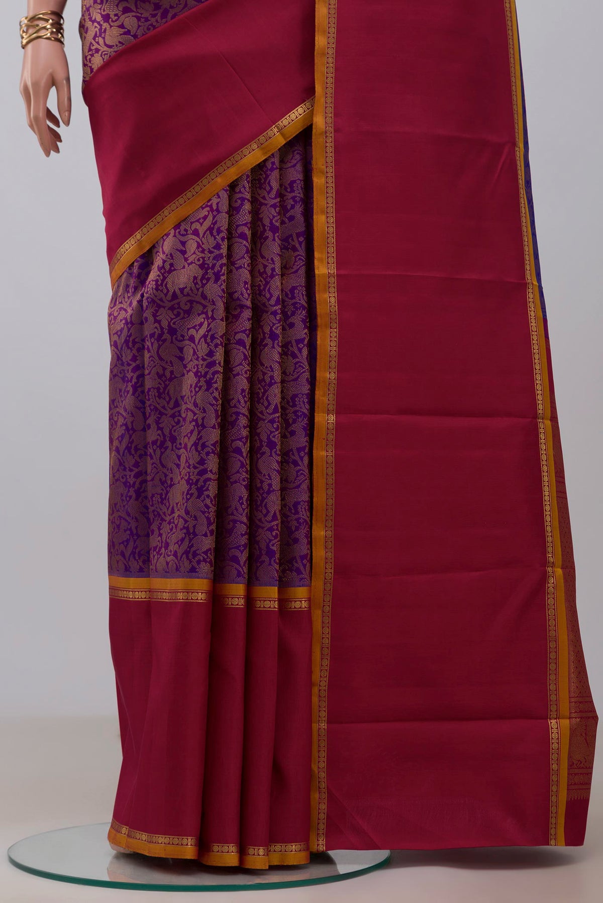 Pleats and pallu of Pure Silk Pure Zari Purple Kanjivaram Saree with Zari Brocade on the body and Ganga Jamuna Border. 