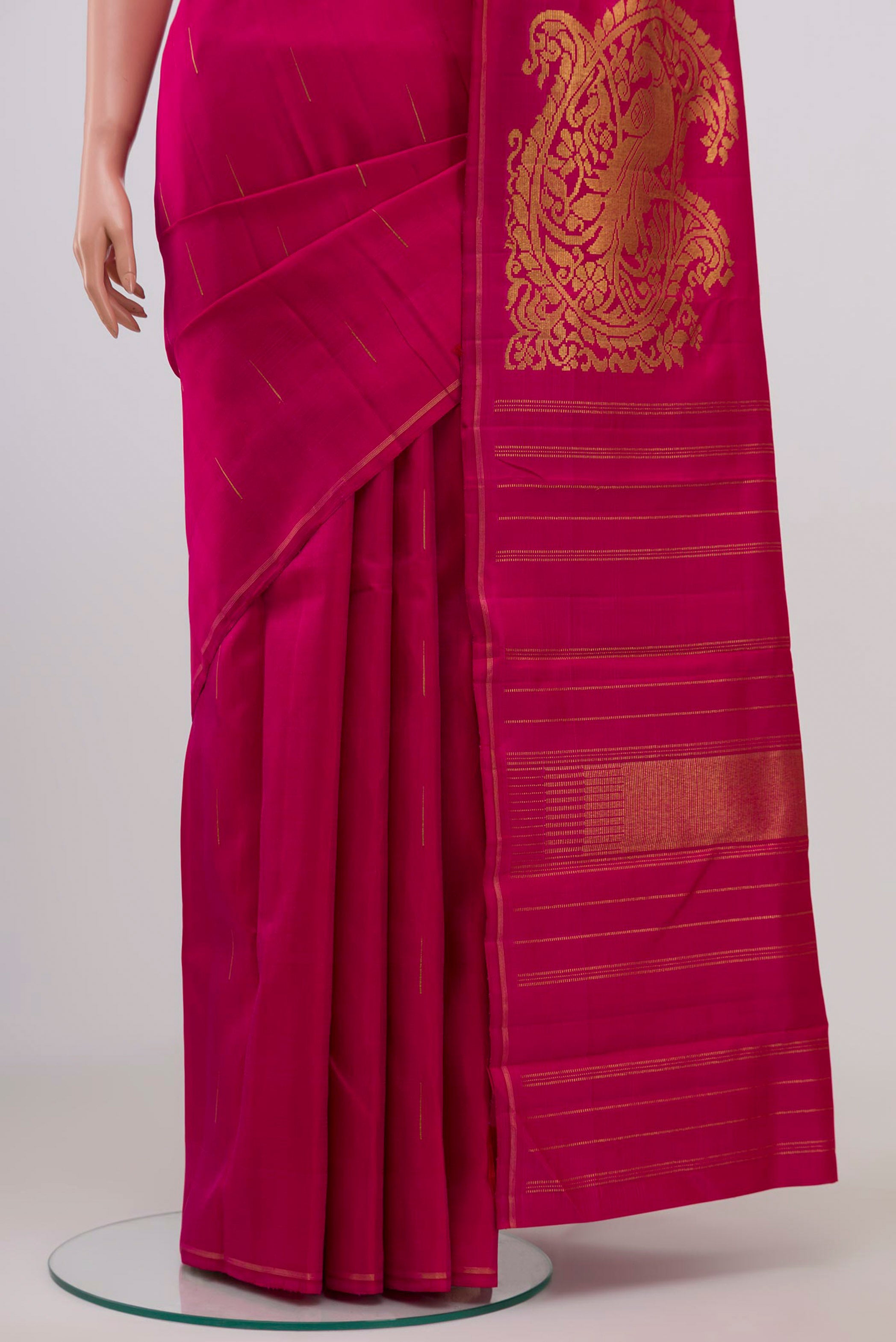 Pleats and pallu of Pure Silk Pure Zari Pink Kanjivaram Saree with Zari Butta on the body and Thin Zari Line. 