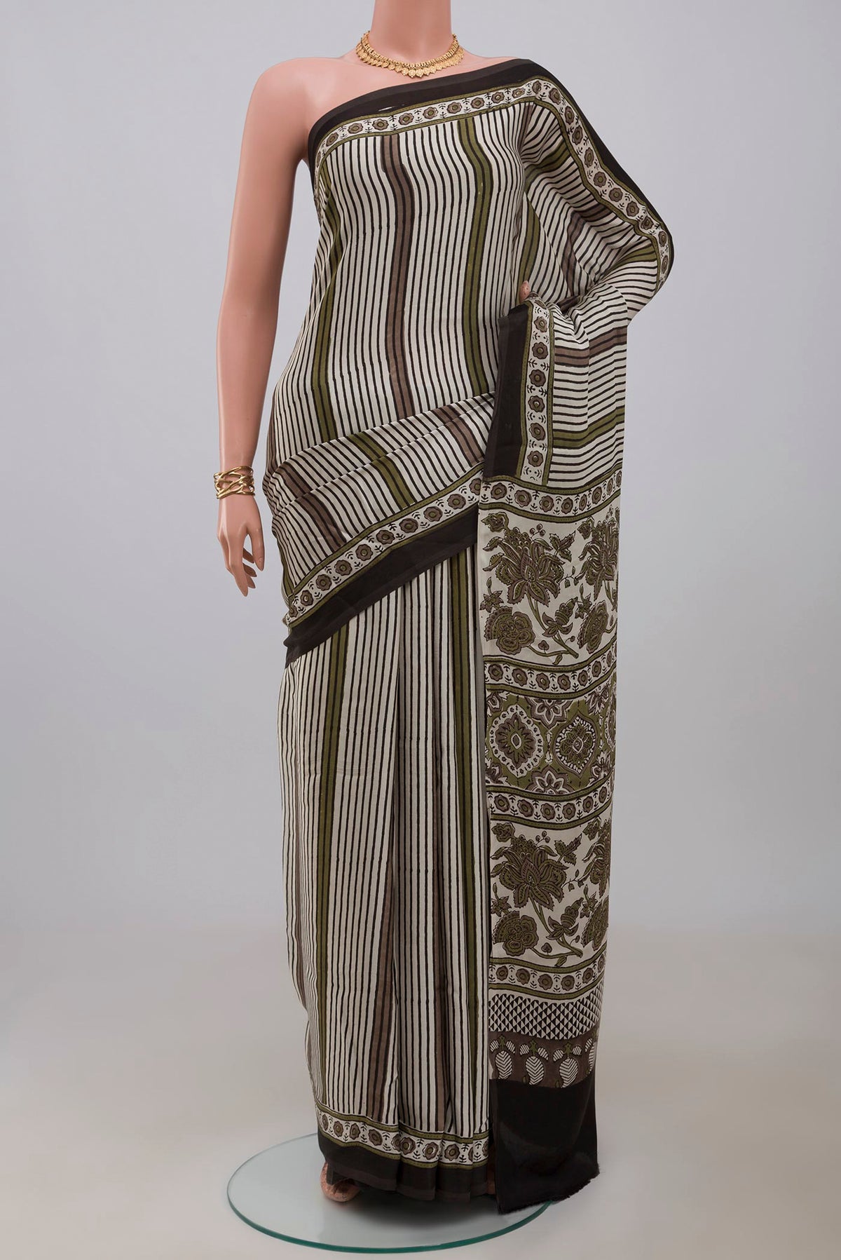 Cream Blended Satin Silk Saree with Ajrakh Print on the body and Printed Border.  displayed on a mannequin