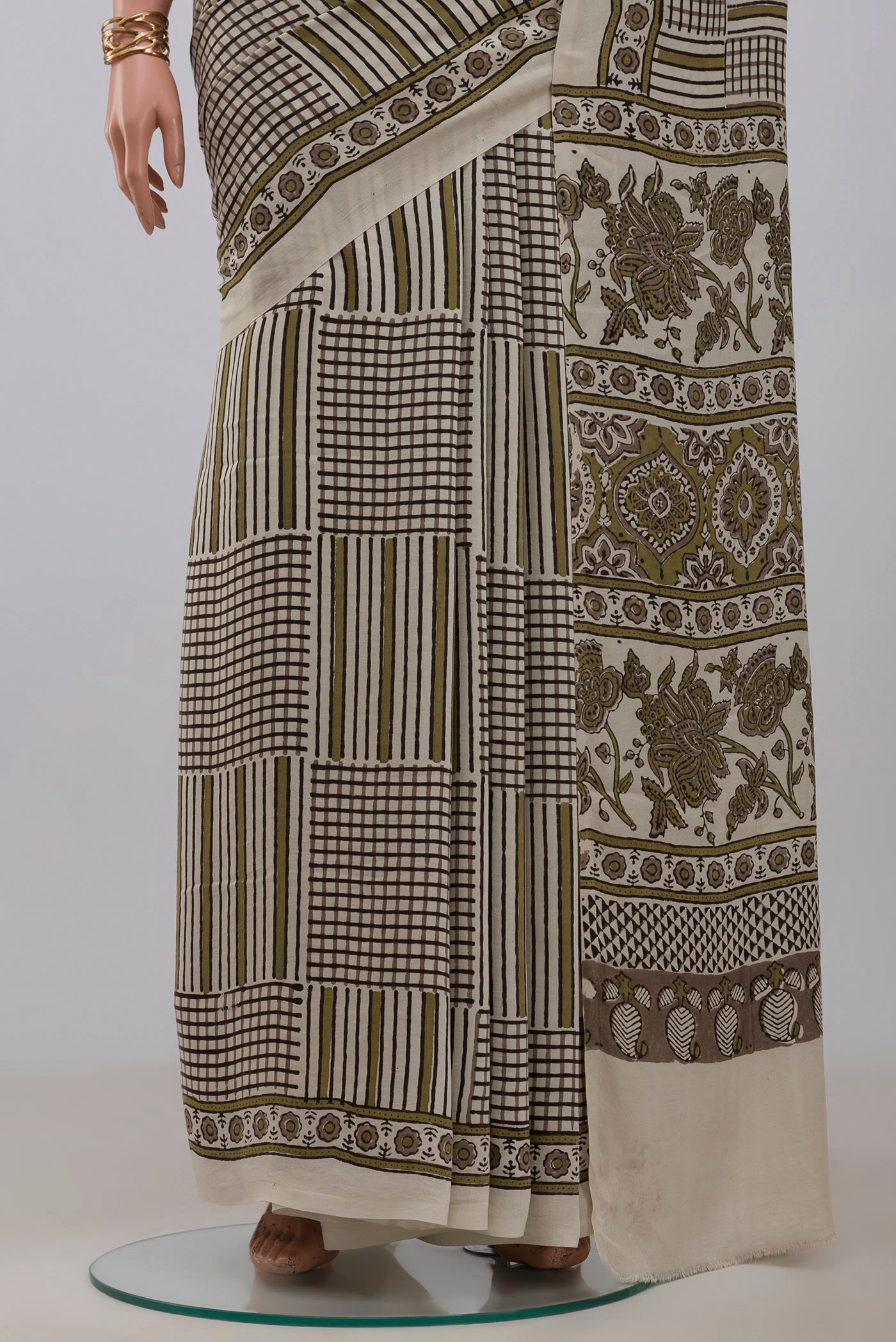 Pleats and pallu of Cream Blended Satin Silk Saree with Ajrakh Print on the body and Printed Border. 