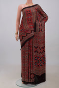 Maroon Blended Satin Silk Saree with Ajrakh Print on the body and Printed Border.  displayed on a mannequin