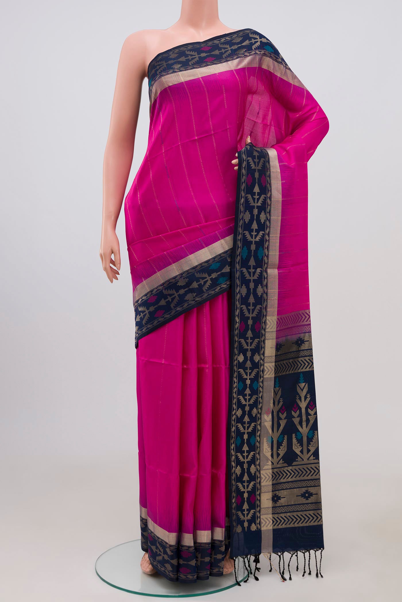 Pink Soft Silk Saree with Zari Butta on the body and Thin Zari Line.  displayed on a mannequin