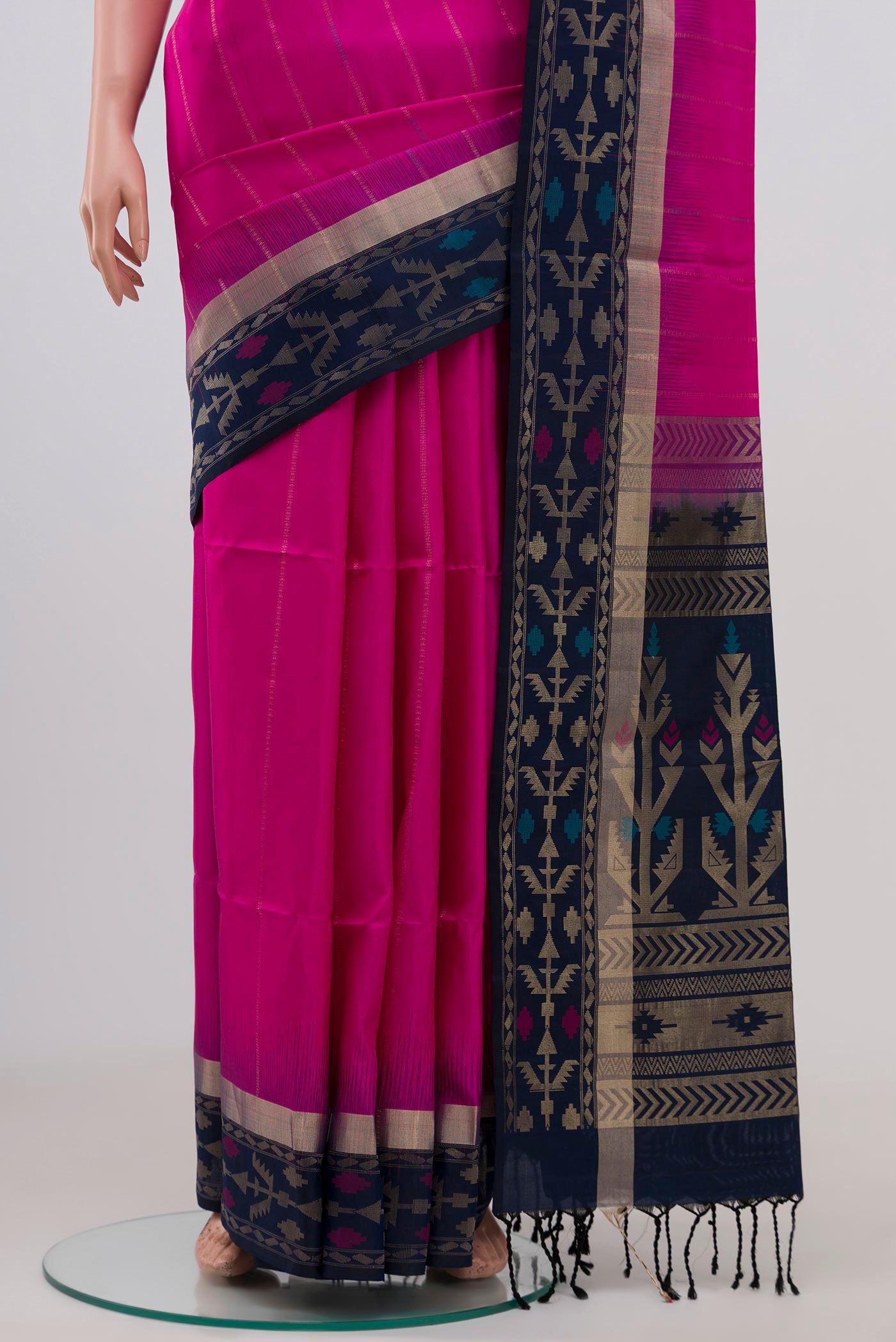 Pleats and pallu of Pink Soft Silk Saree with Zari Butta on the body and Thin Zari Line. 