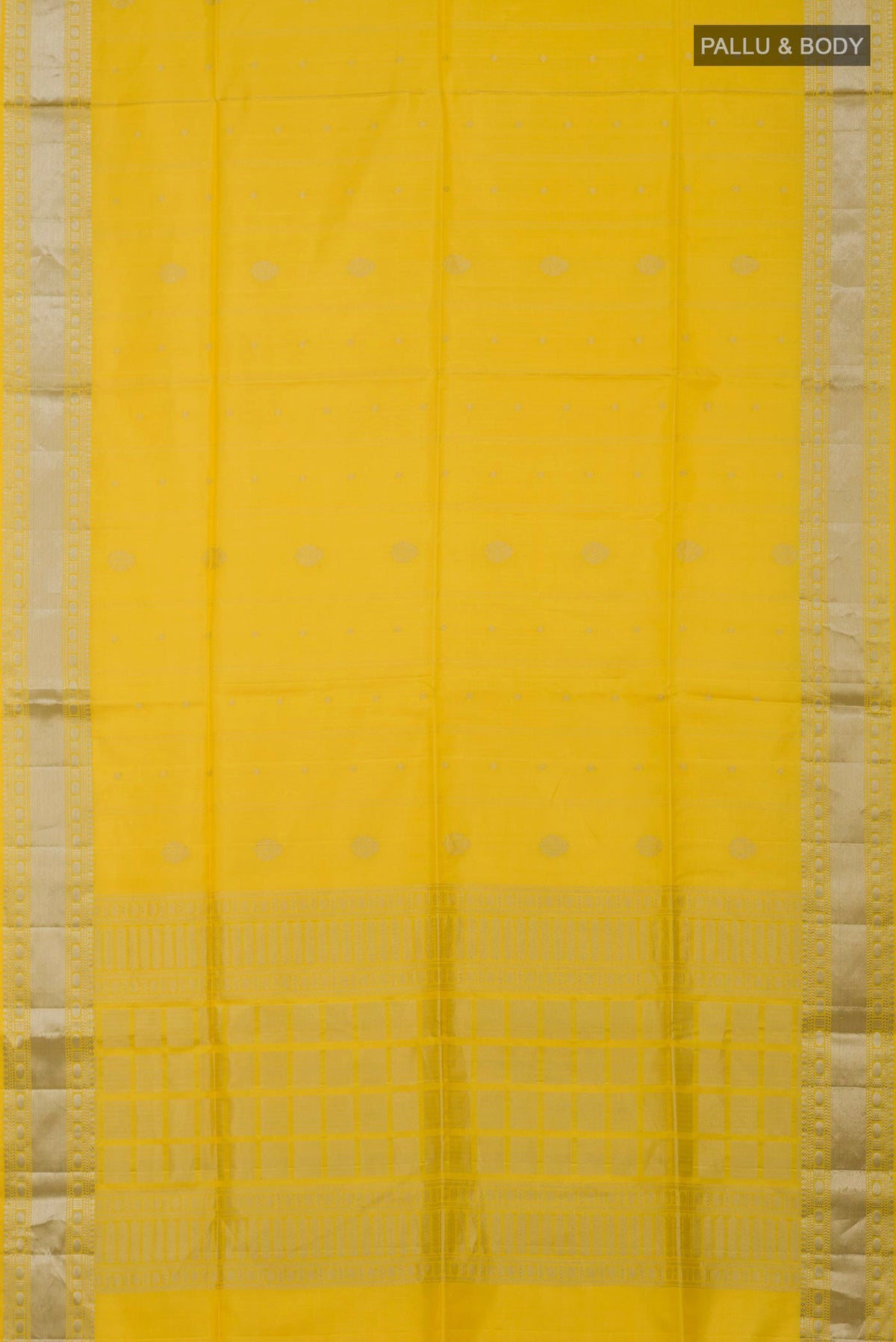 Flat view of Yellow Soft Silk Saree with Zari Butta on the body and Zari Border. 