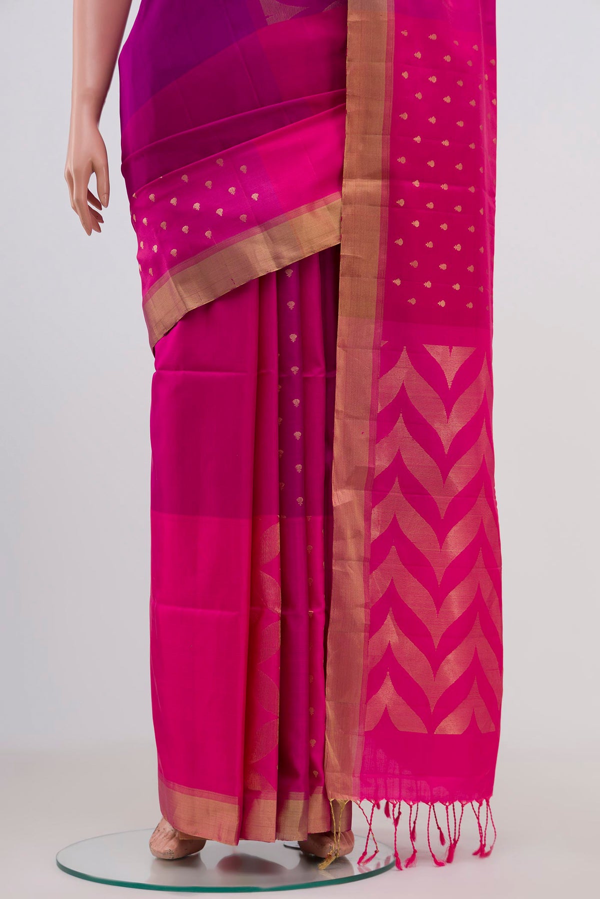 Pleats and pallu of Pink Soft Silk Saree with Checked design on the body and Zari Border. 