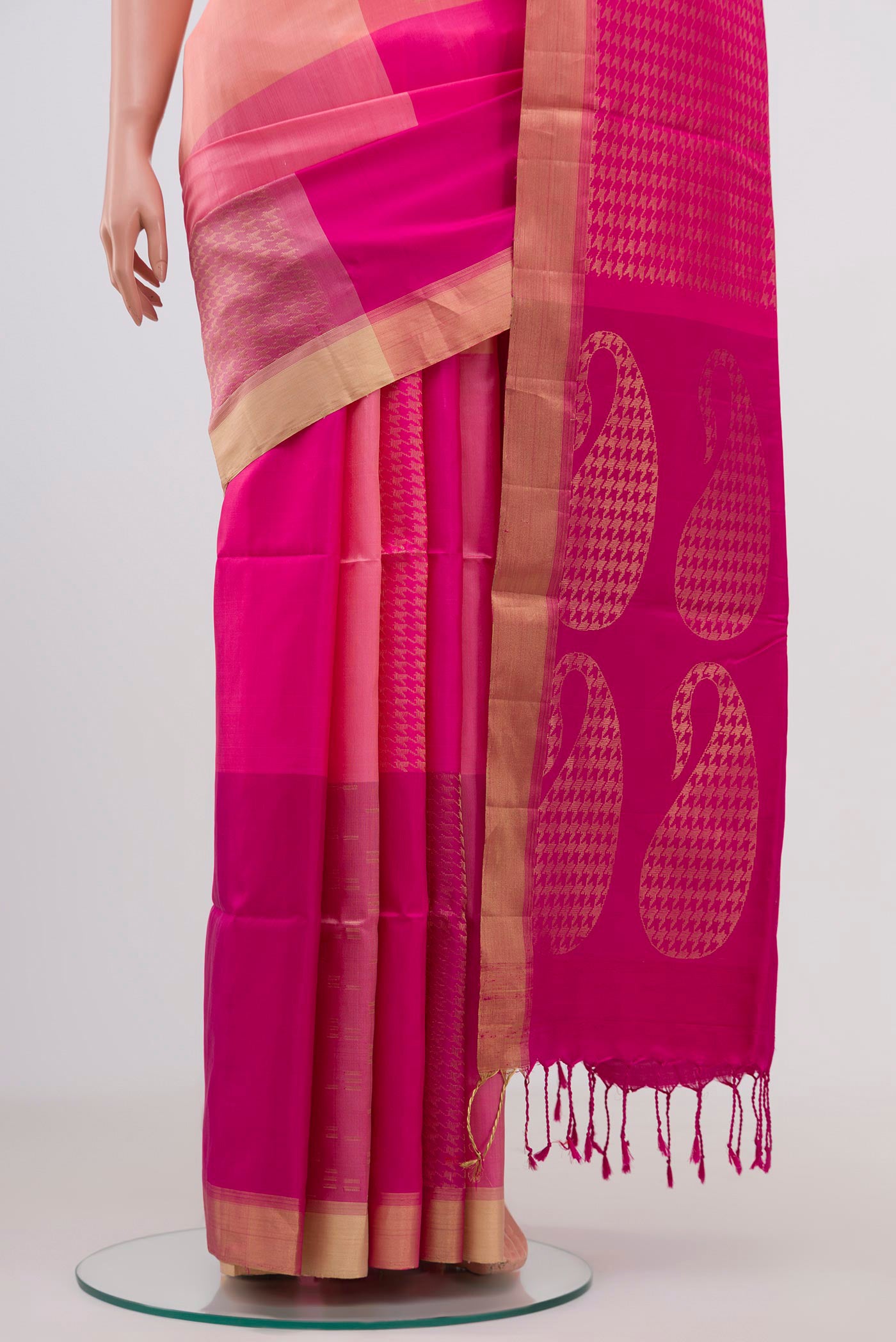 Pleats and pallu of Pink Soft Silk Saree with Checked design on the body and Zari Border. 