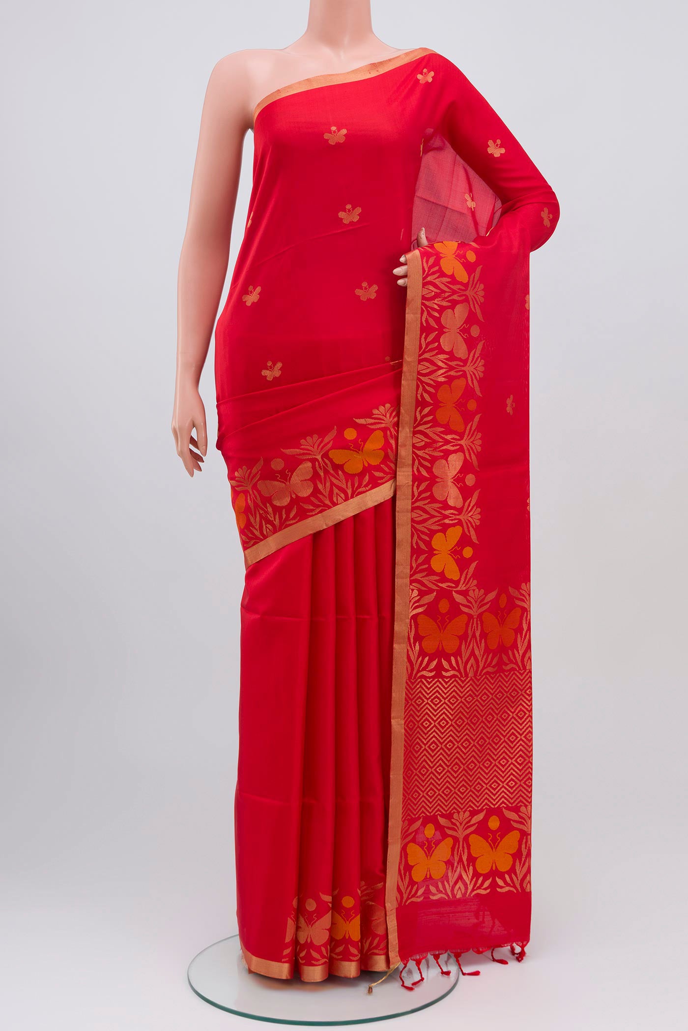 Red Soft Silk Saree with Zari Butta on the body and Fancy Border.  displayed on a mannequin