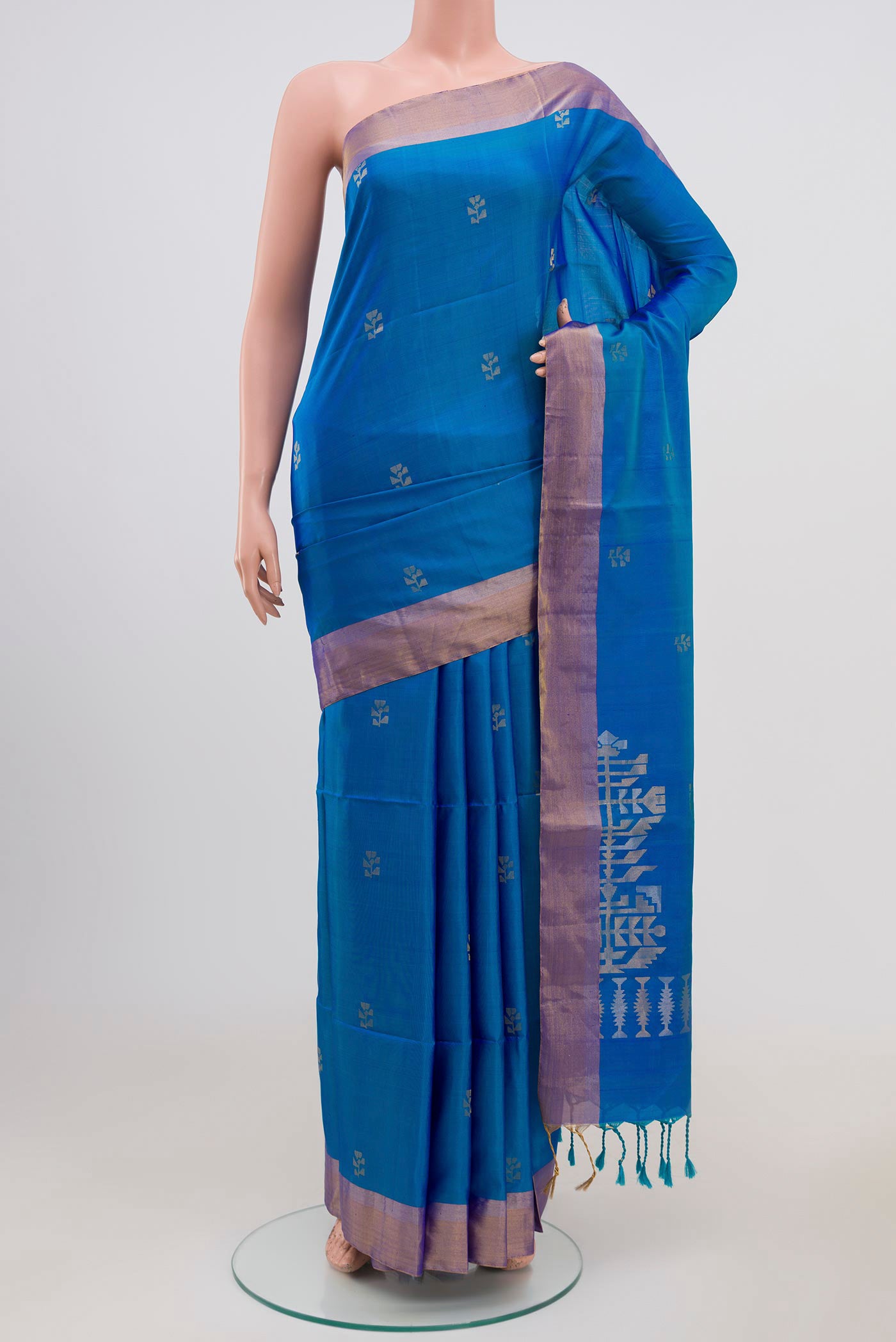 Light Blue Soft Silk Saree with Zari Butta on the body and Zari Border.  displayed on a mannequin