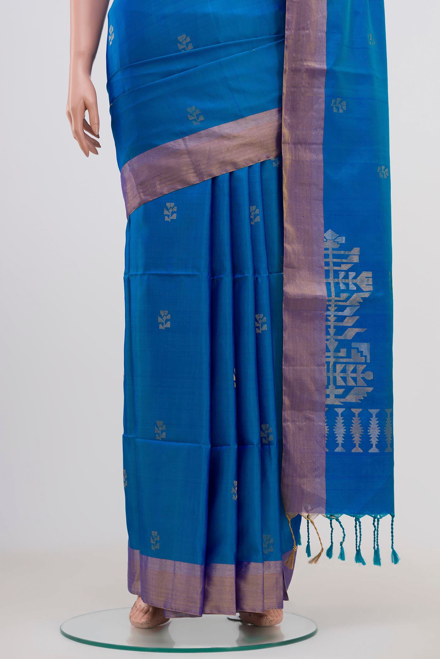 Pleats and pallu of Light Blue Soft Silk Saree with Zari Butta on the body and Zari Border. 