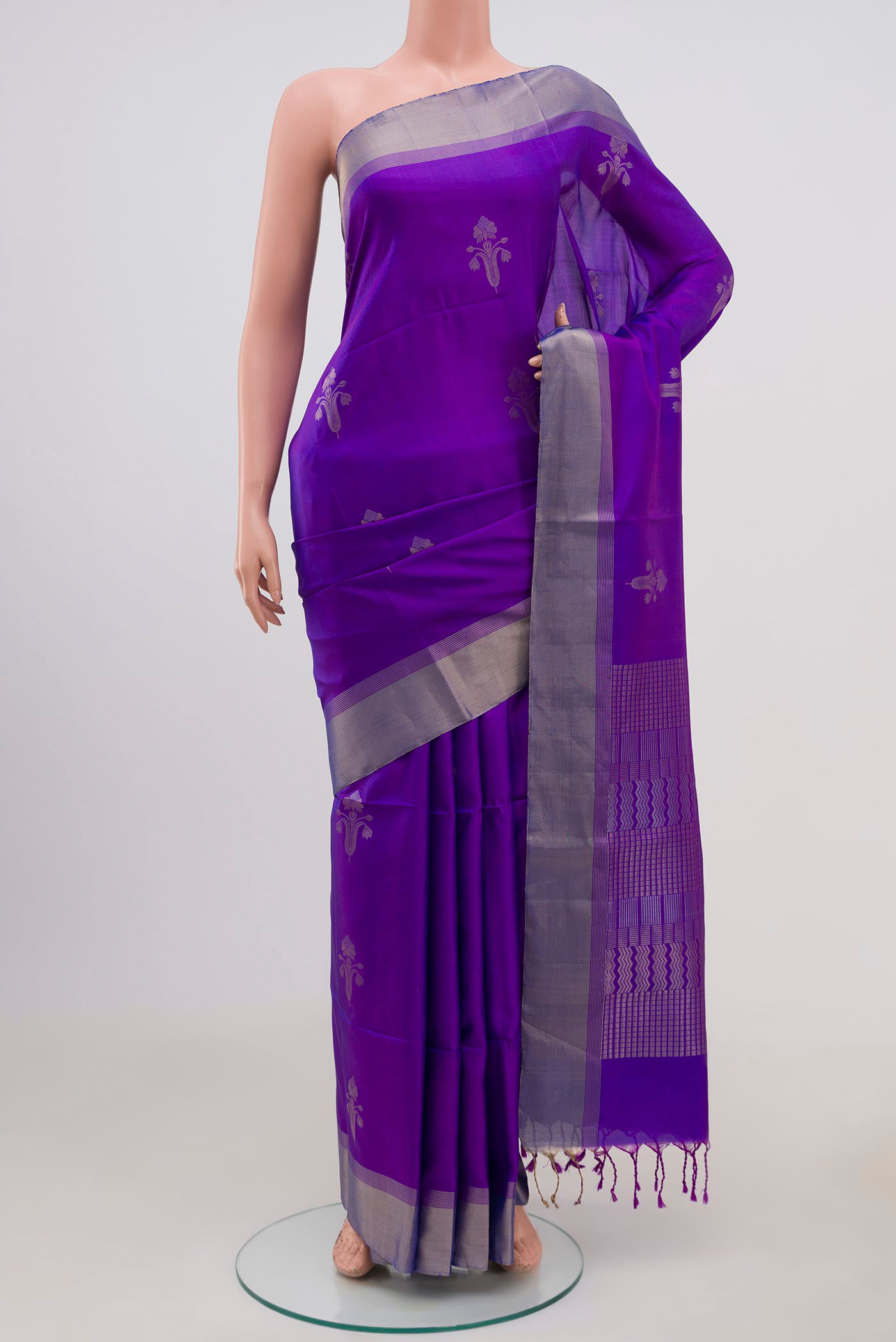 Lavender Soft Silk Saree with Zari Butta on the body and Zari Border.  displayed on a mannequin