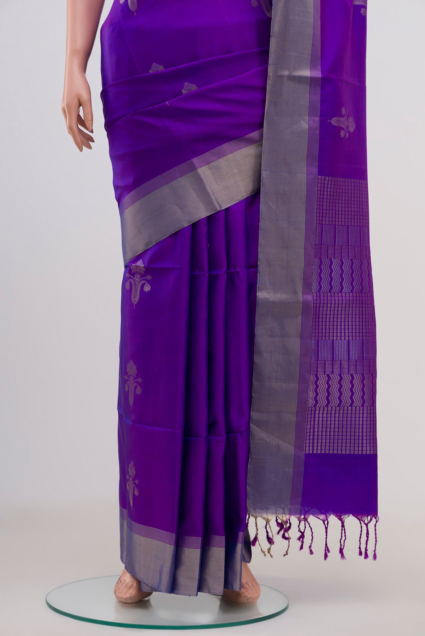 Pleats and pallu of Lavender Soft Silk Saree with Zari Butta on the body and Zari Border. 