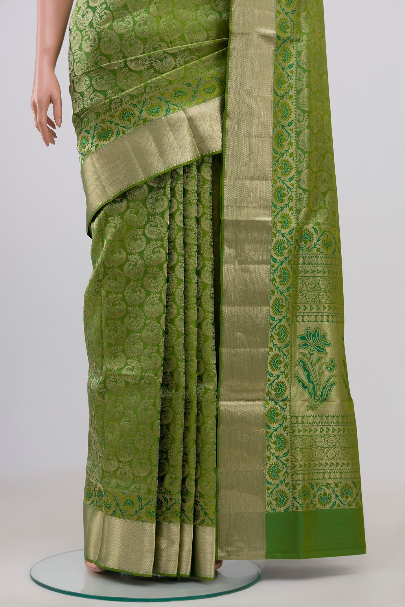 Pleats and pallu of Green Soft Silk Saree with Zari Brocade on the body and Zari Border. 