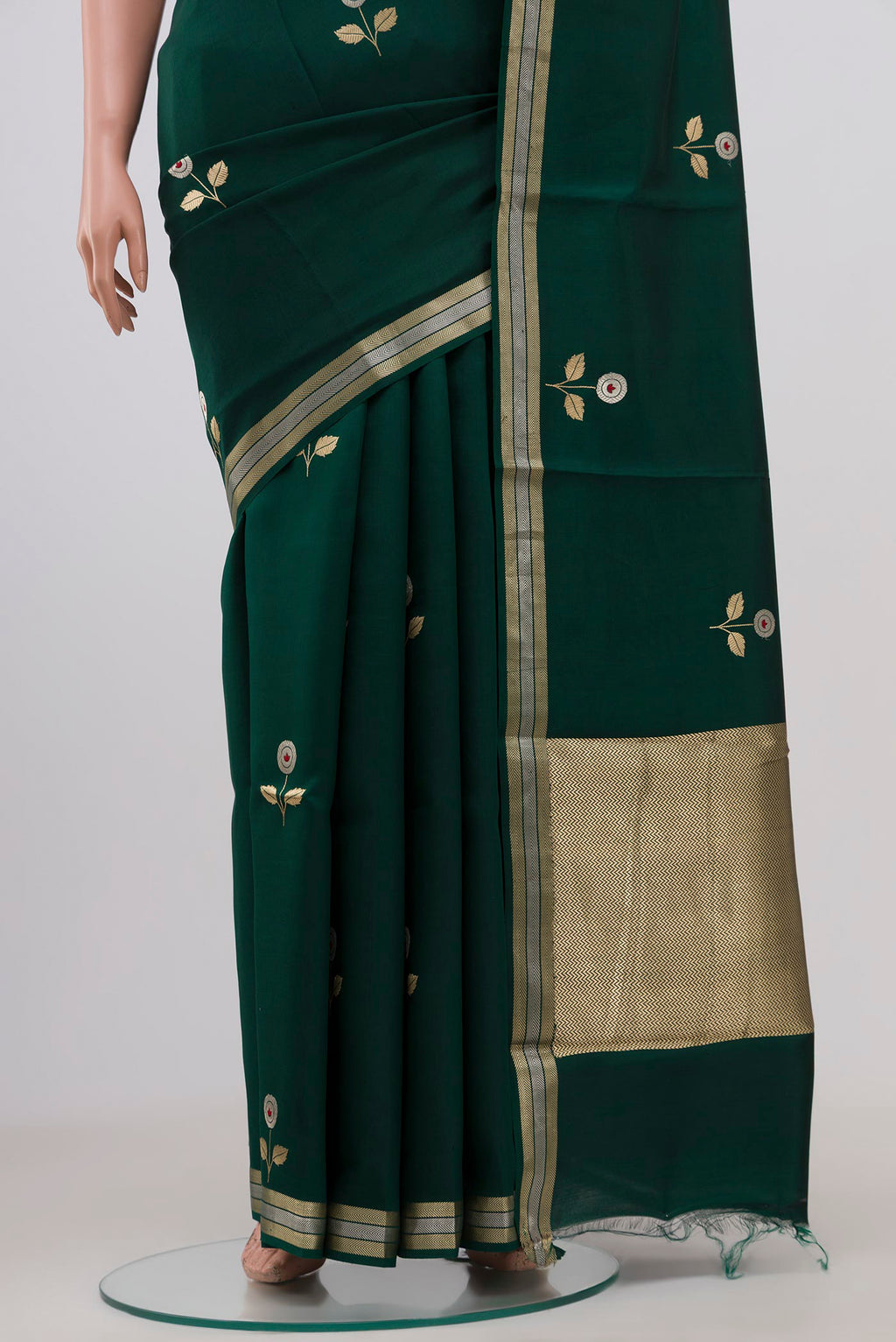 Pleats and pallu of Bottle Green Banarasi Katan Silk Saree with Zari Butta on the body and Zari Border. 