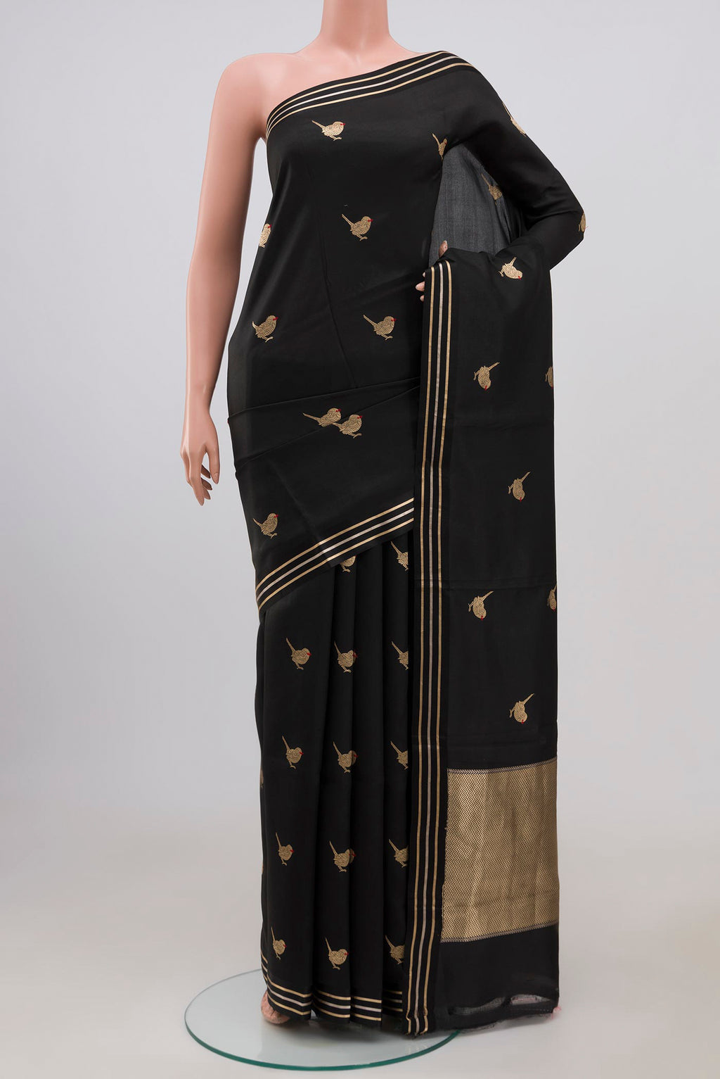 Black Banarasi Katan Silk Saree with Zari Butta on the body and Thin Zari Line.  displayed on a mannequin