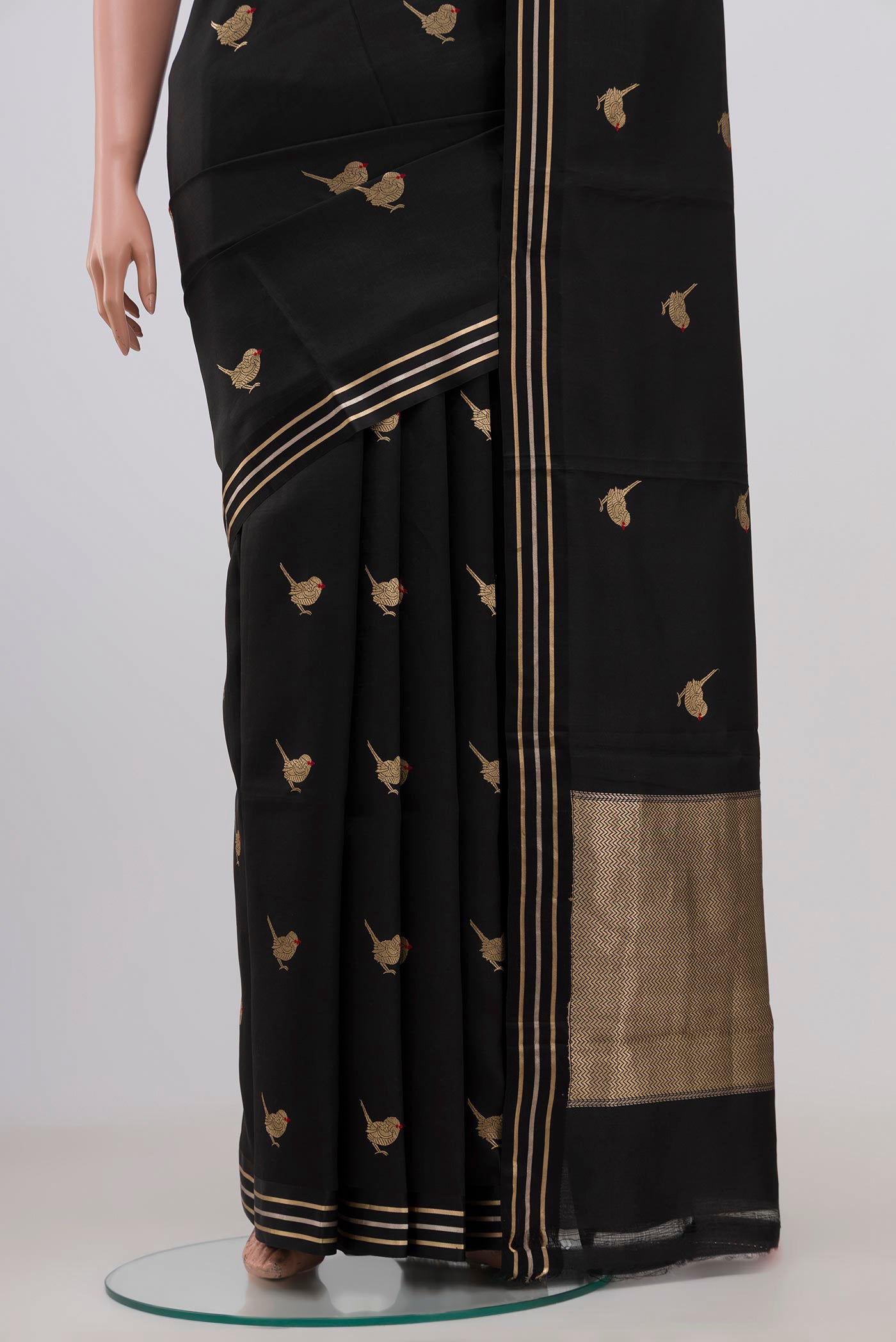 Pleats and pallu of Black Banarasi Katan Silk Saree with Zari Butta on the body and Thin Zari Line. 
