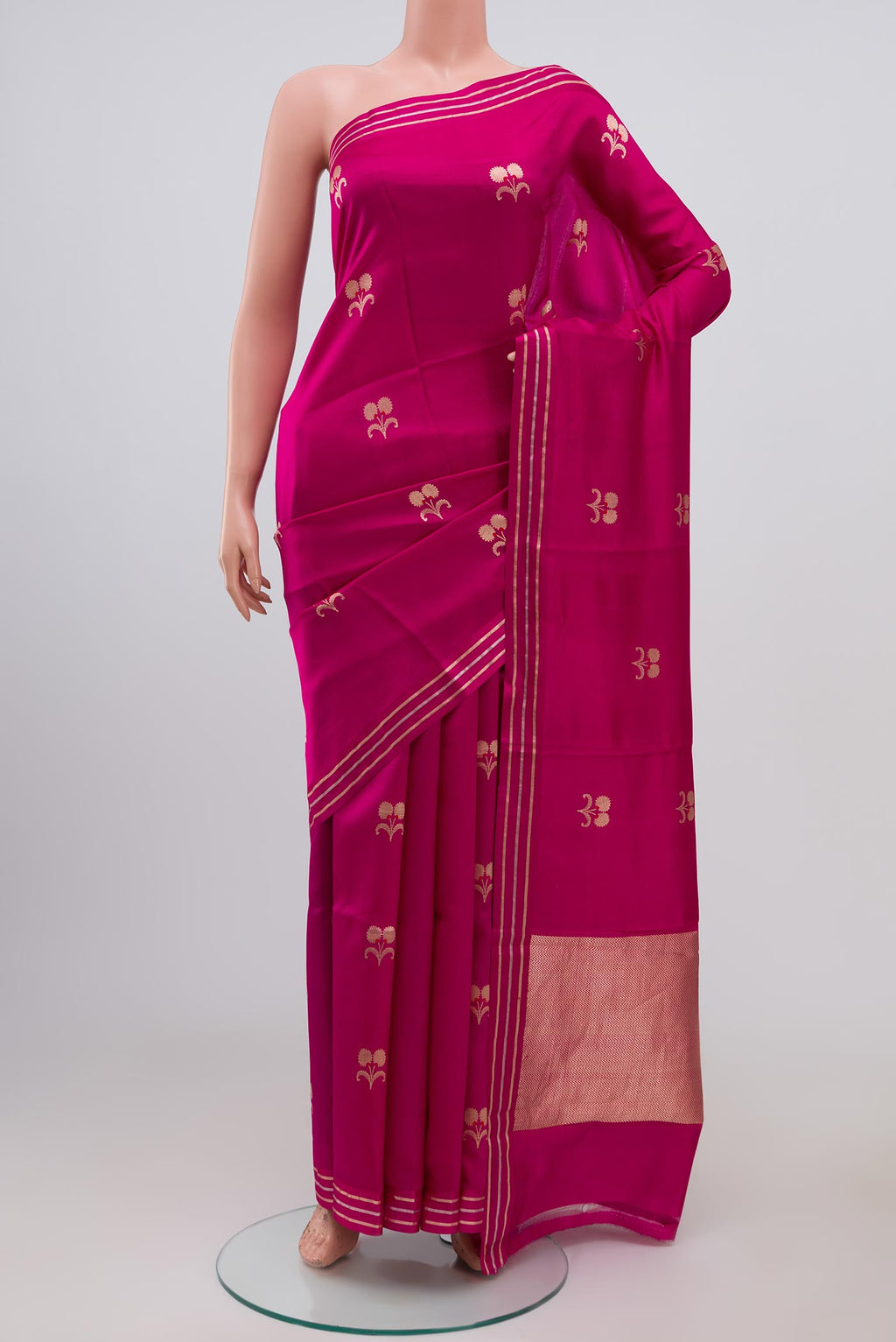 Pink Banarasi Katan Silk Saree with Zari Butta on the body and Thin Zari Line.  displayed on a mannequin